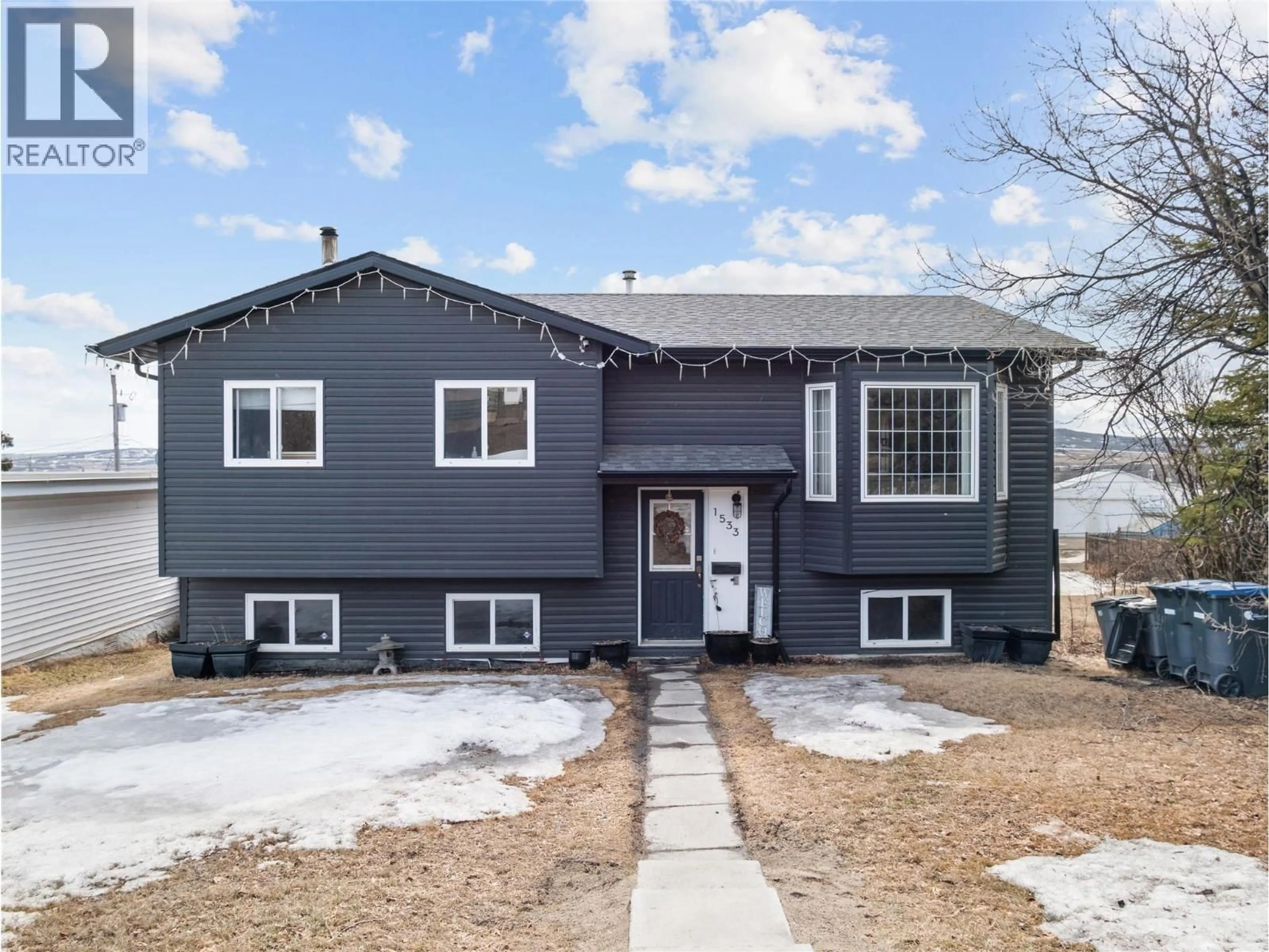Home with vinyl exterior material, street for 1533 96 AVENUE, Dawson Creek British Columbia V1G1L7