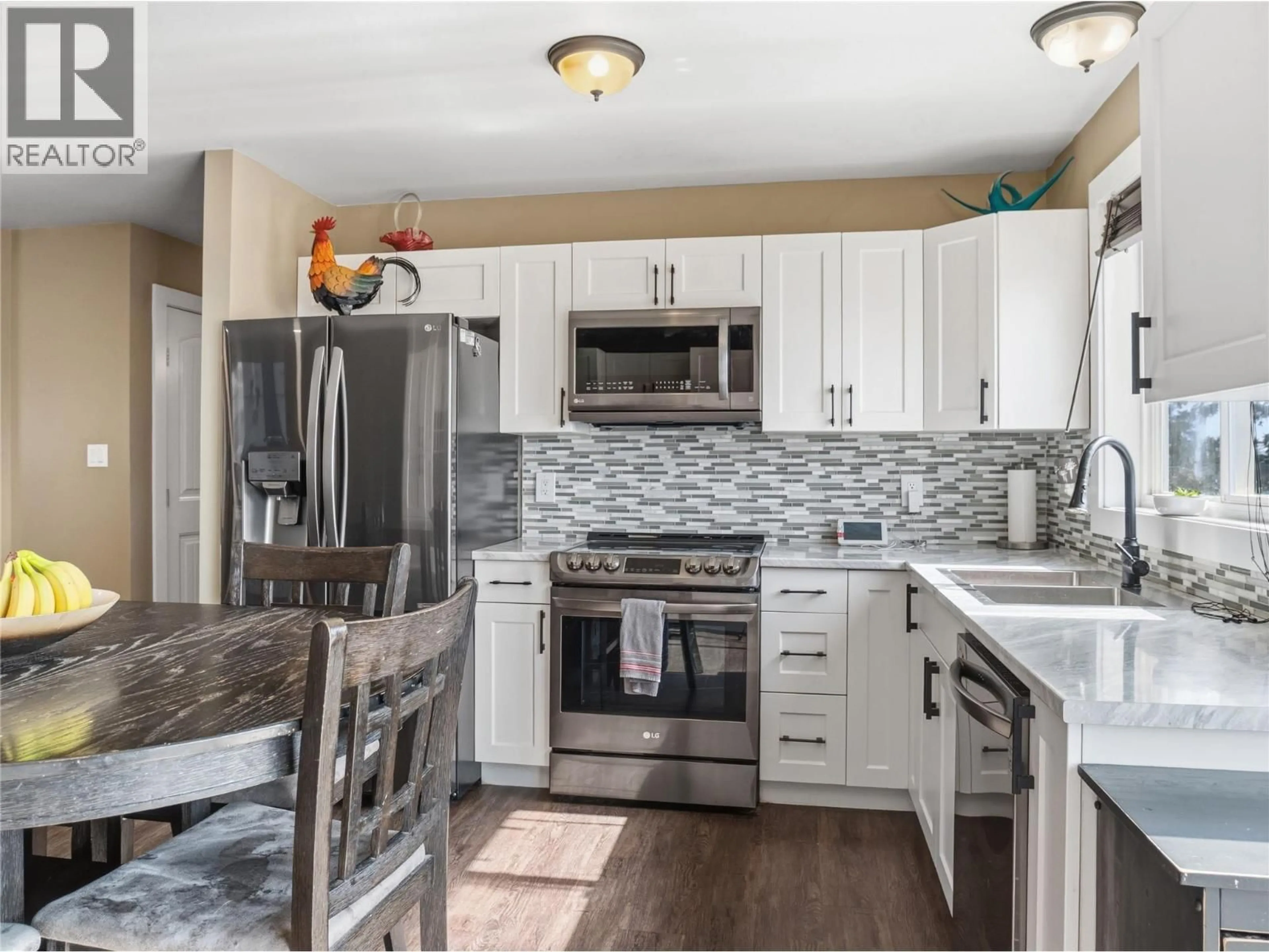 Open concept kitchen, ceramic/tile floor for 1533 96 AVENUE, Dawson Creek British Columbia V1G1L7