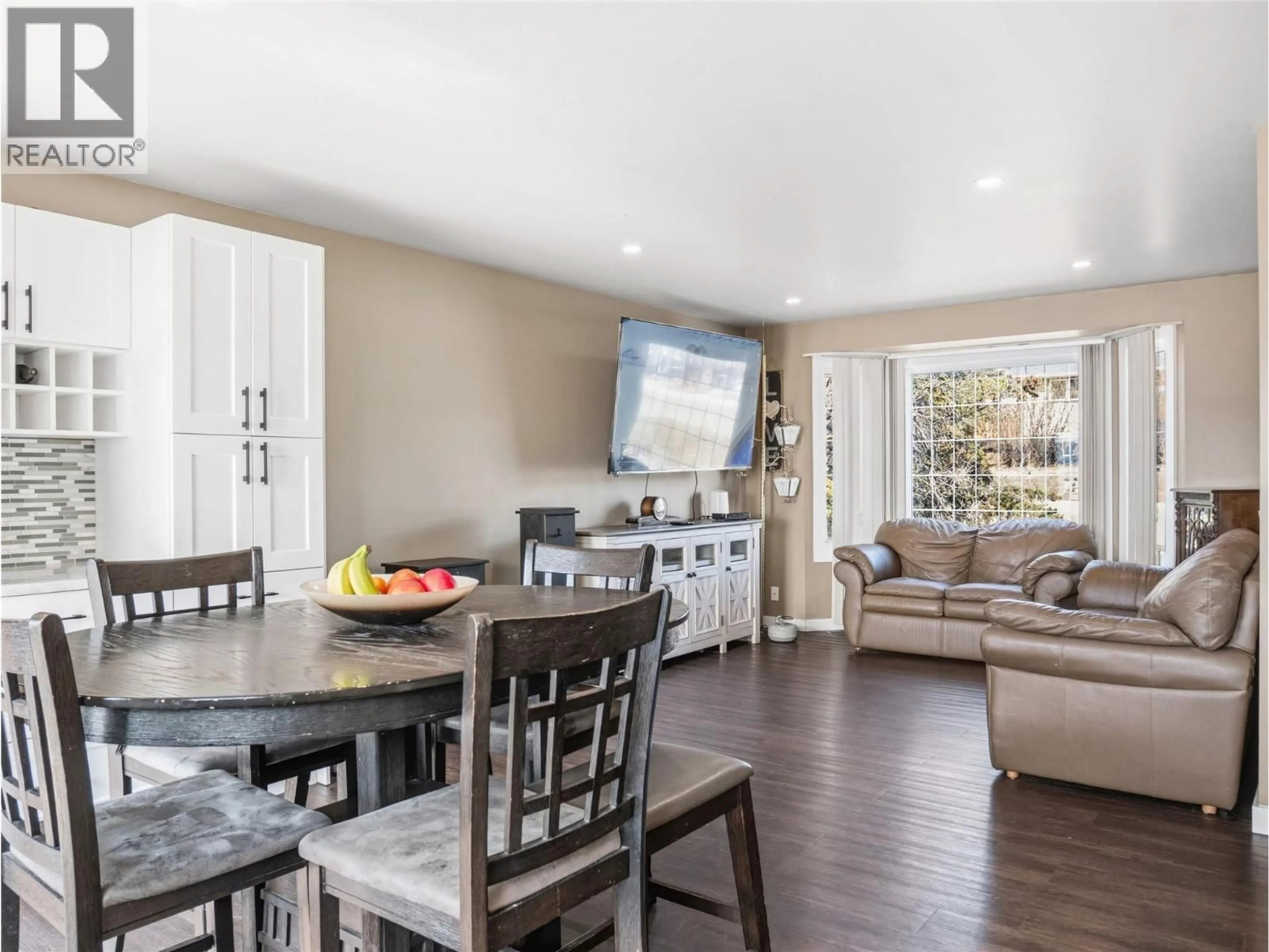 Open concept kitchen, wood/laminate floor for 1533 96 AVENUE, Dawson Creek British Columbia V1G1L7