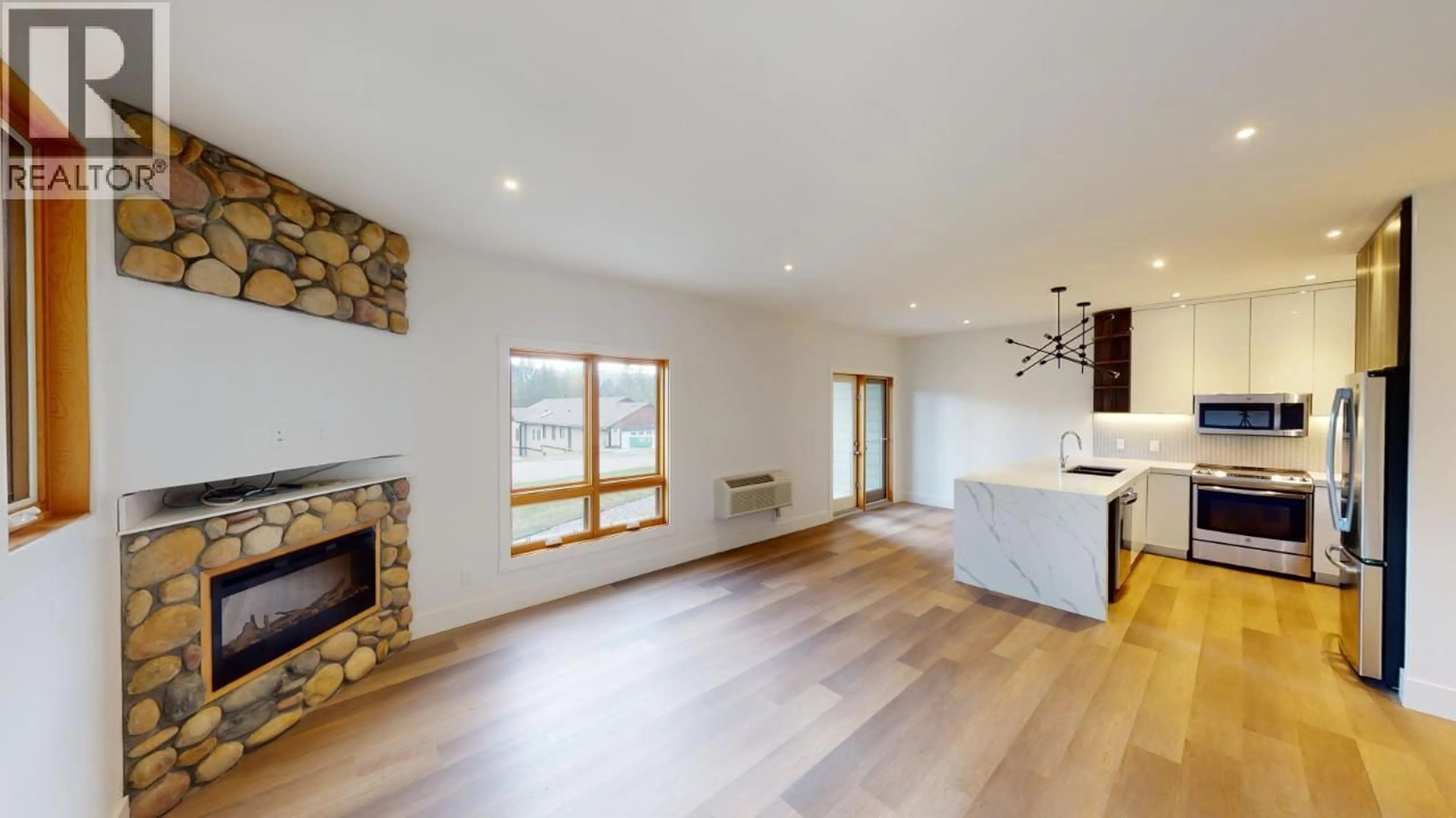 Open concept kitchen, wood/laminate floor for 301 - 7291 PROSPECTOR AVENUE, Radium Hot Springs British Columbia V0A1M0