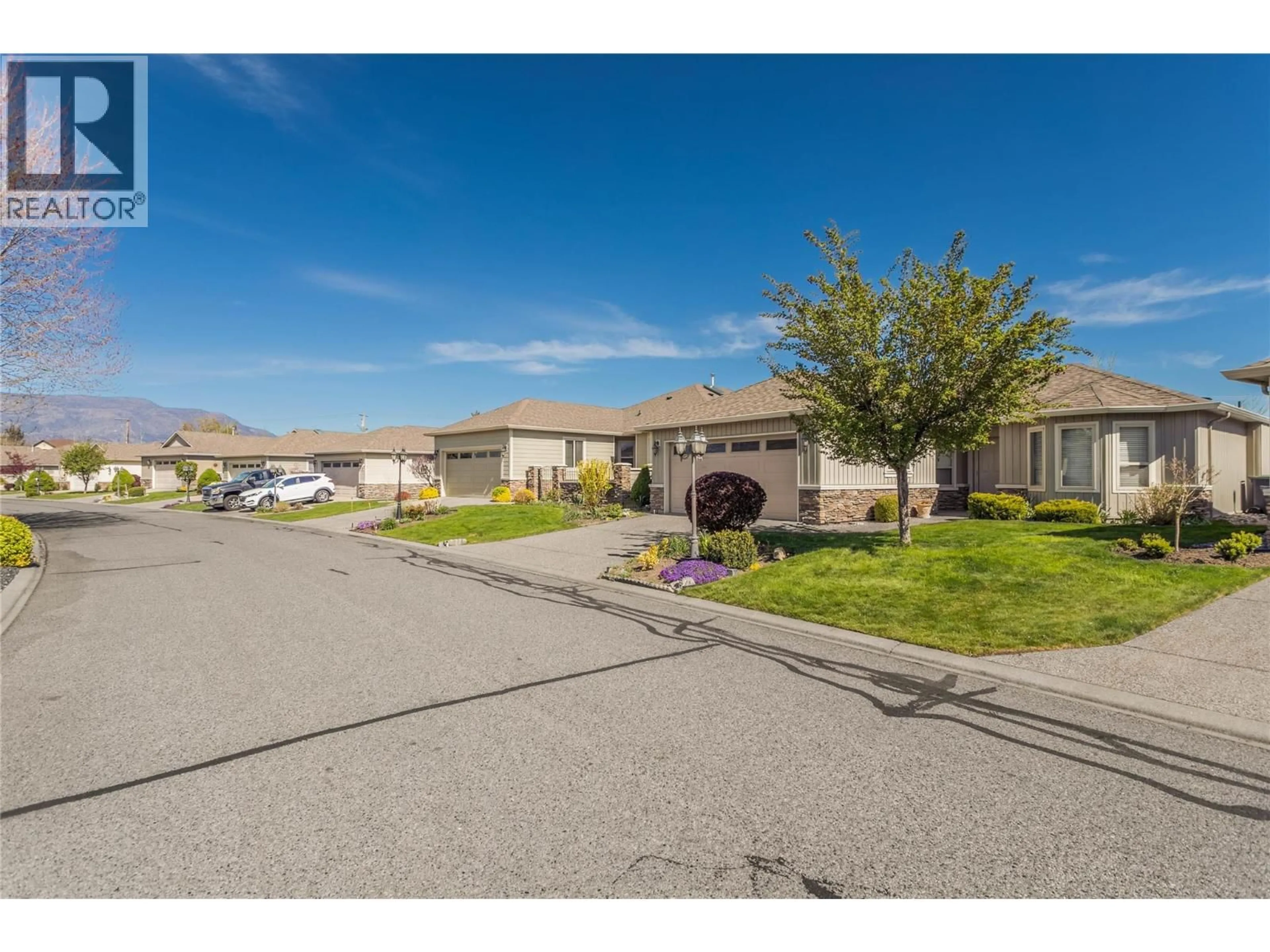 A pic from outside/outdoor area/front of a property/back of a property/a pic from drone, street for 49 - 2365 STILLINGFLEET ROAD, Kelowna British Columbia V1W4X5