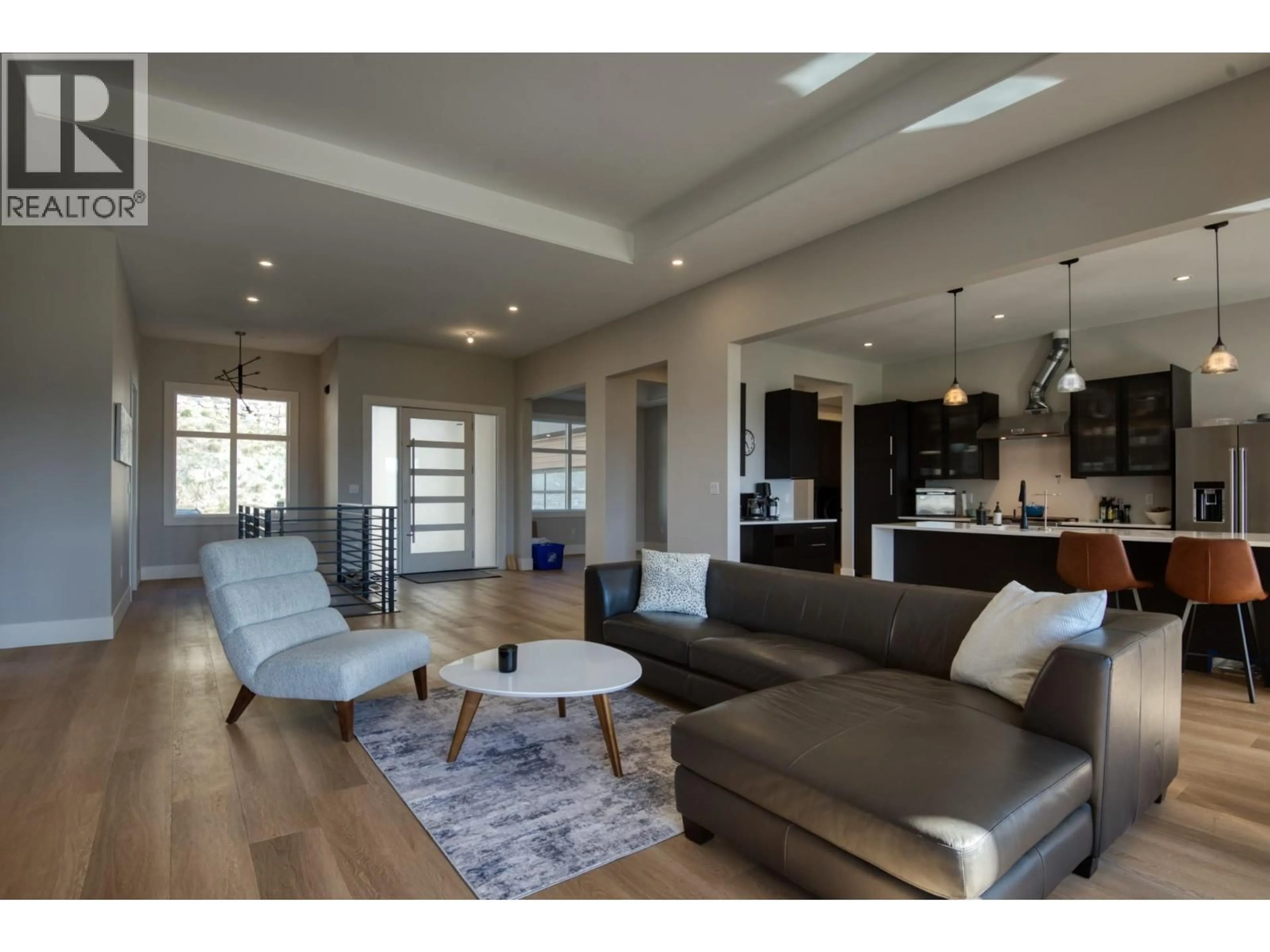 Living room with furniture, wood/laminate floor for 2835 OUTLOOK WAY, Naramata British Columbia V0H1N1