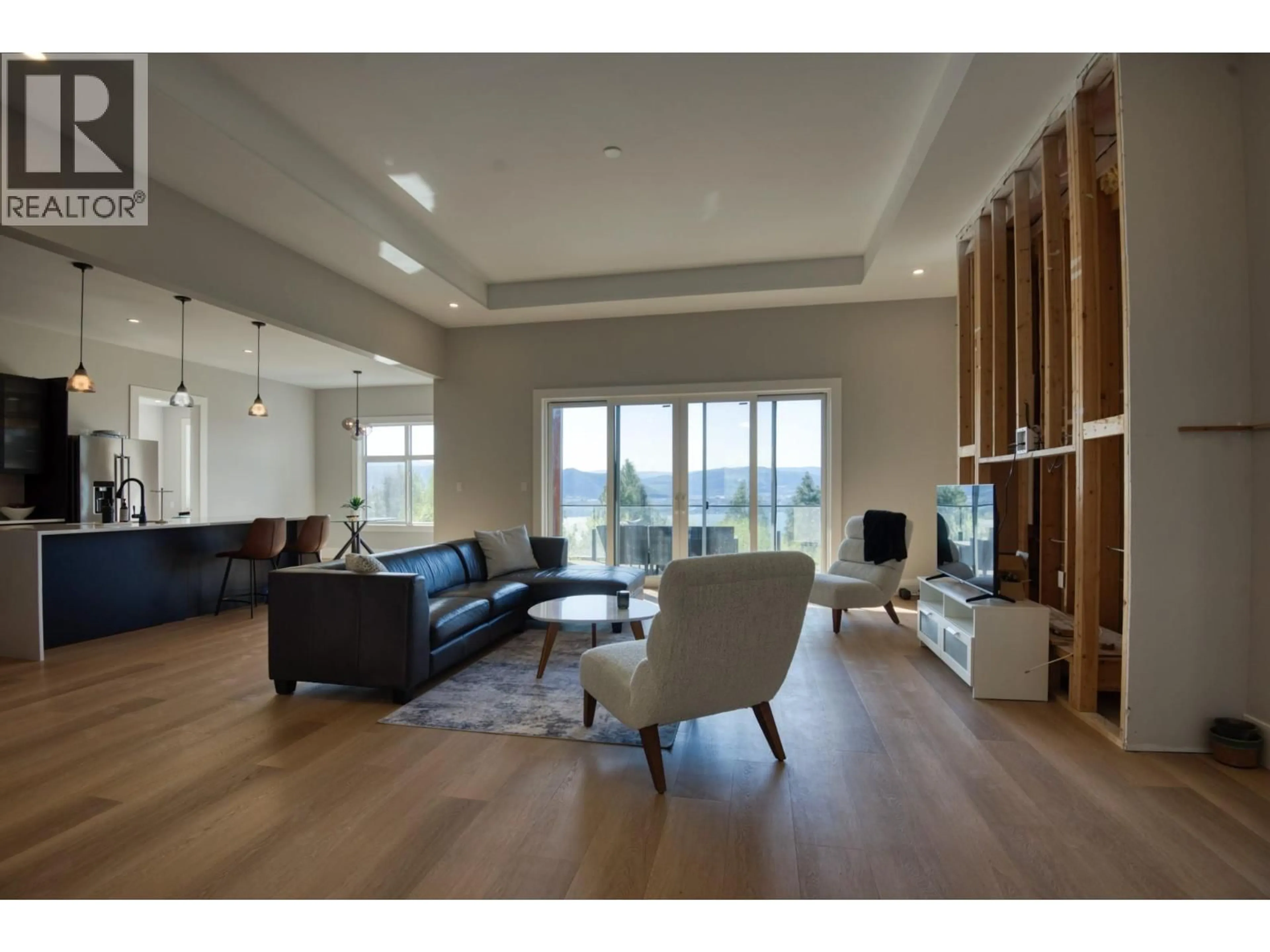 Living room with furniture, wood/laminate floor for 2835 OUTLOOK WAY, Naramata British Columbia V0H1N1