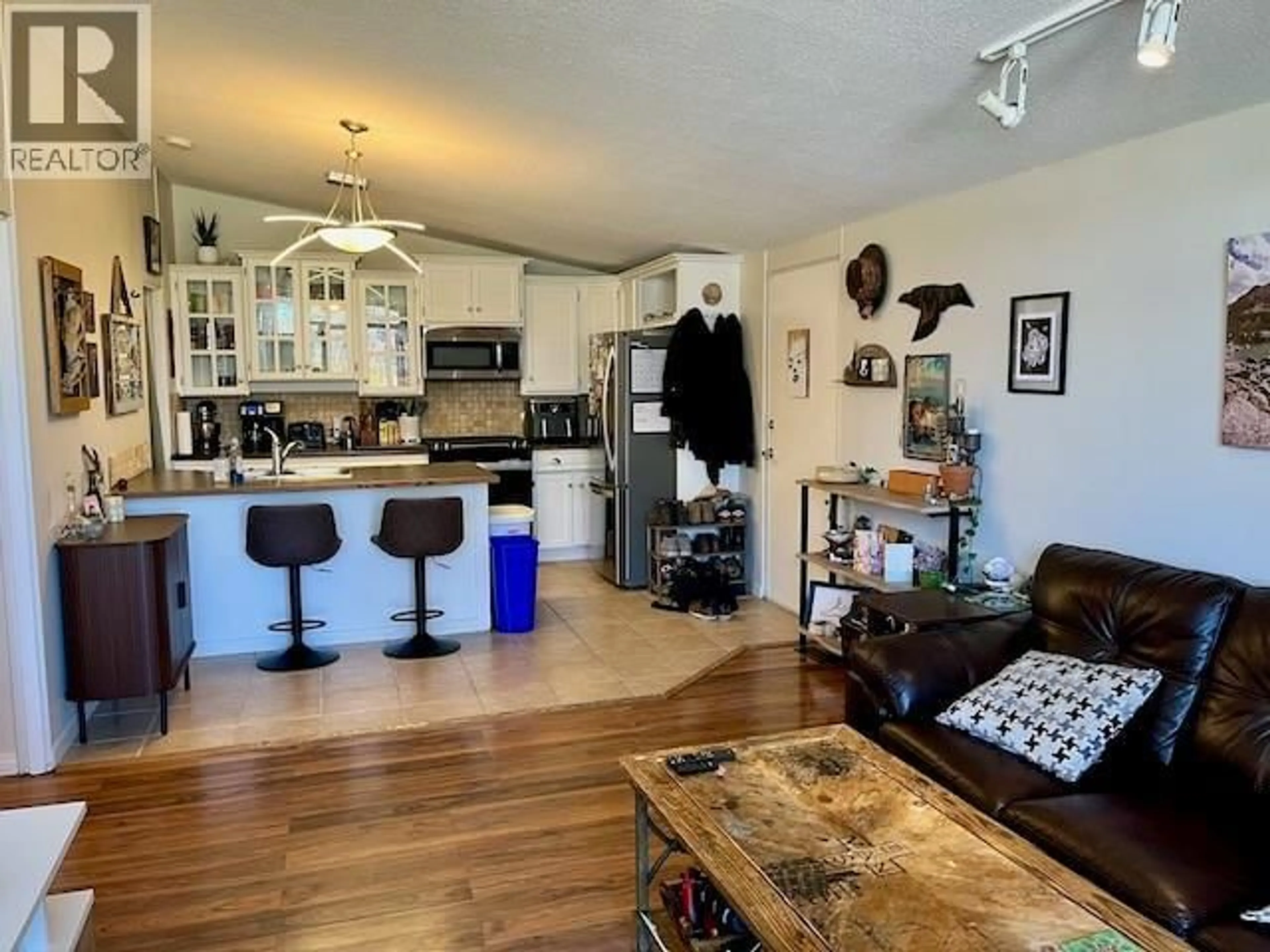 Open concept kitchen, wood/laminate floor for 11 - 353 BOYCE CRESCENT, Kelowna British Columbia V1Y5Z7