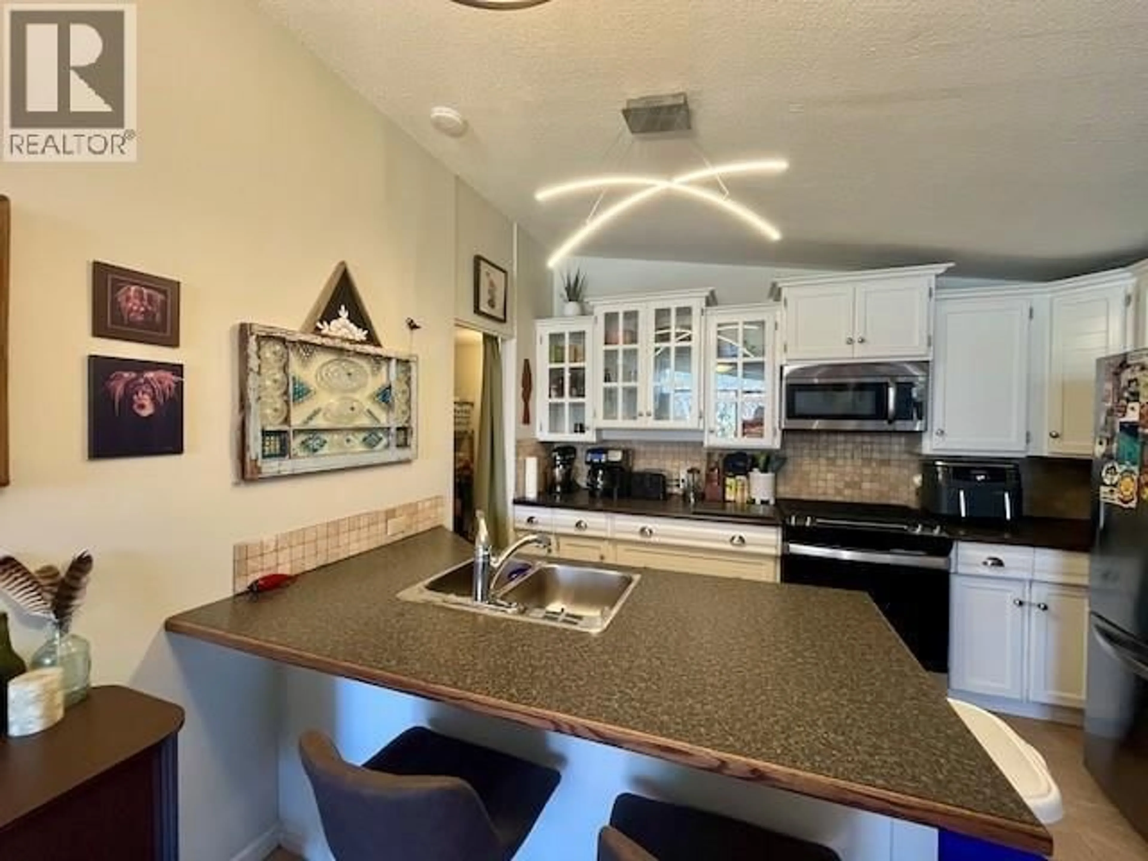 Open concept kitchen, ceramic/tile floor for 11 - 353 BOYCE CRESCENT, Kelowna British Columbia V1Y5Z7