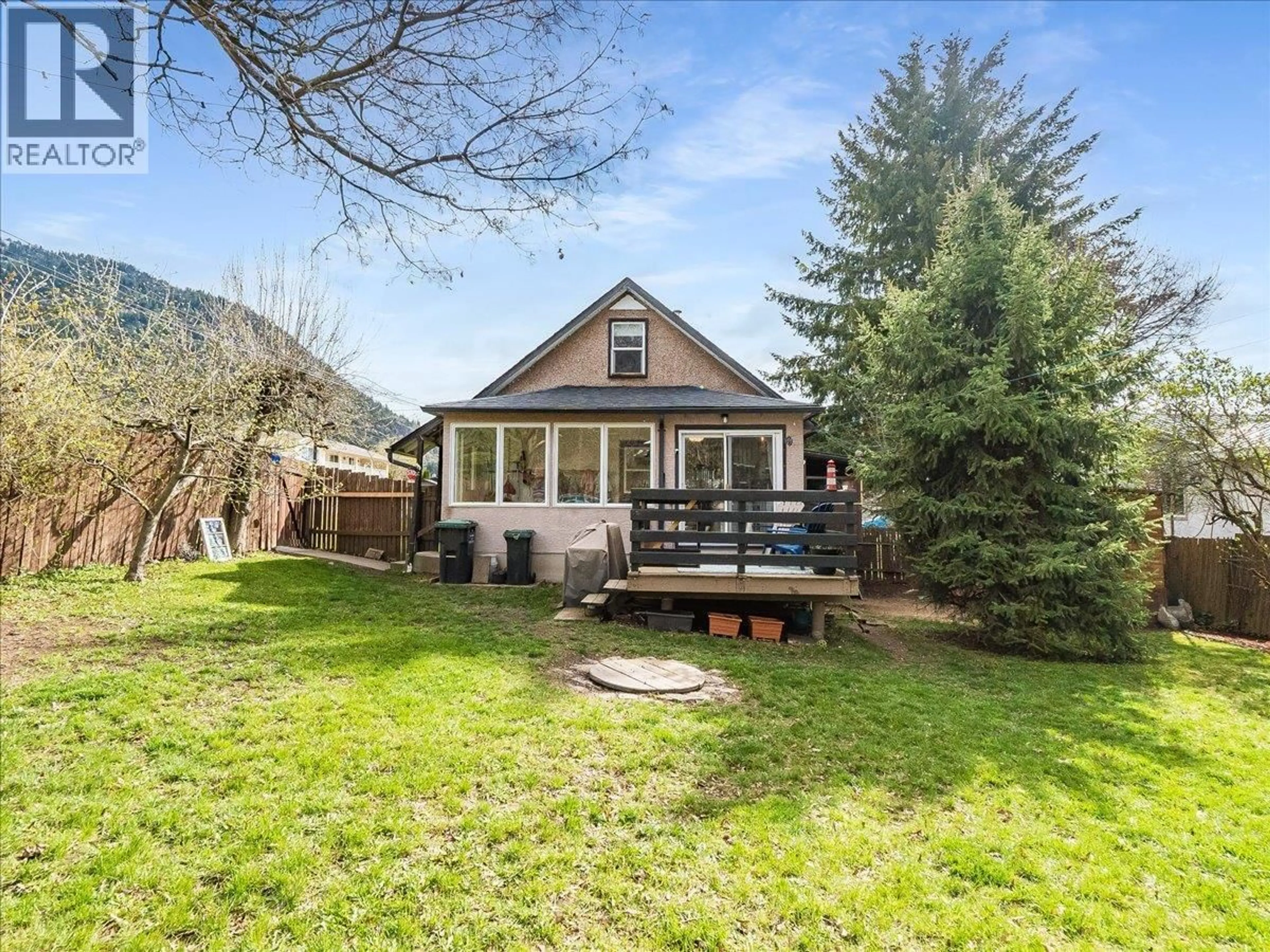 A pic from outside/outdoor area/front of a property/back of a property/a pic from drone, mountain view for 702 6TH STREET, Castlegar British Columbia V1N2E9