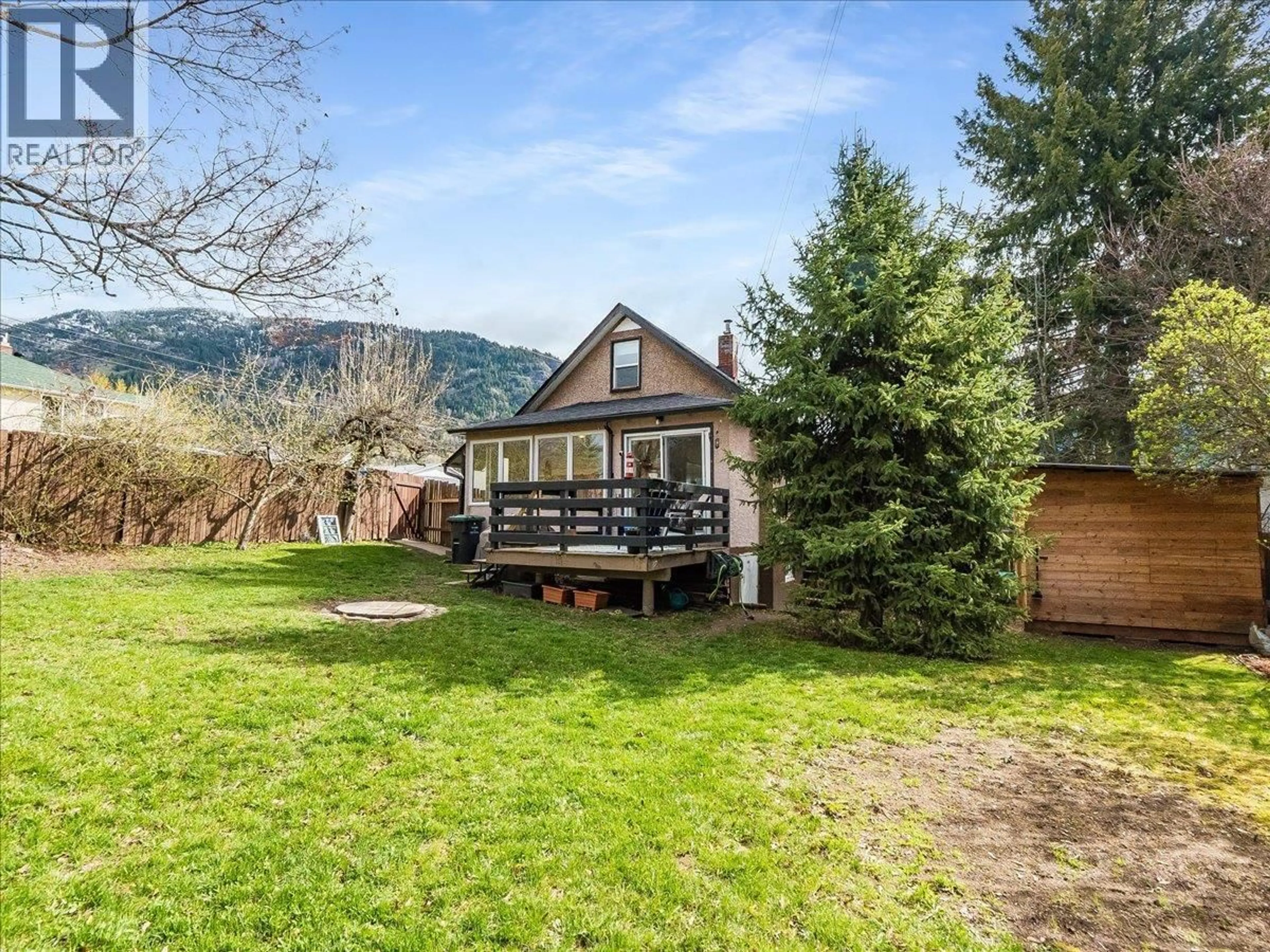 A pic from outside/outdoor area/front of a property/back of a property/a pic from drone, mountain view for 702 6TH STREET, Castlegar British Columbia V1N2E9
