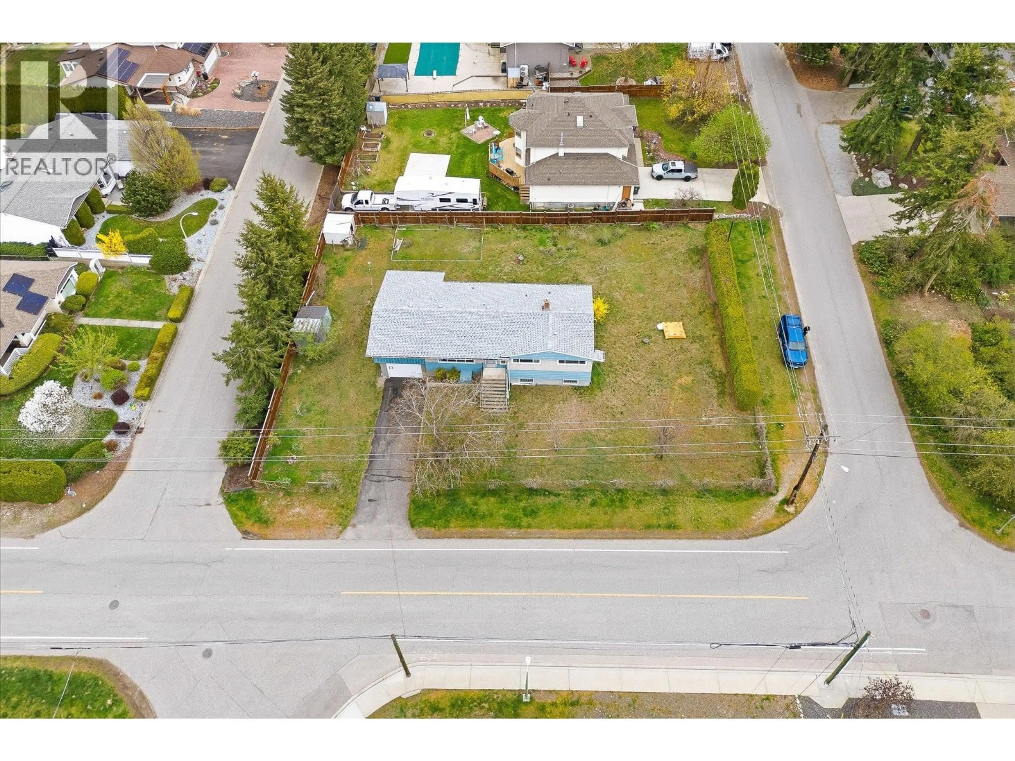 A pic from outside/outdoor area/front of a property/back of a property/a pic from drone, street for 4693 RAYMER ROAD, Kelowna British Columbia V1W1J4