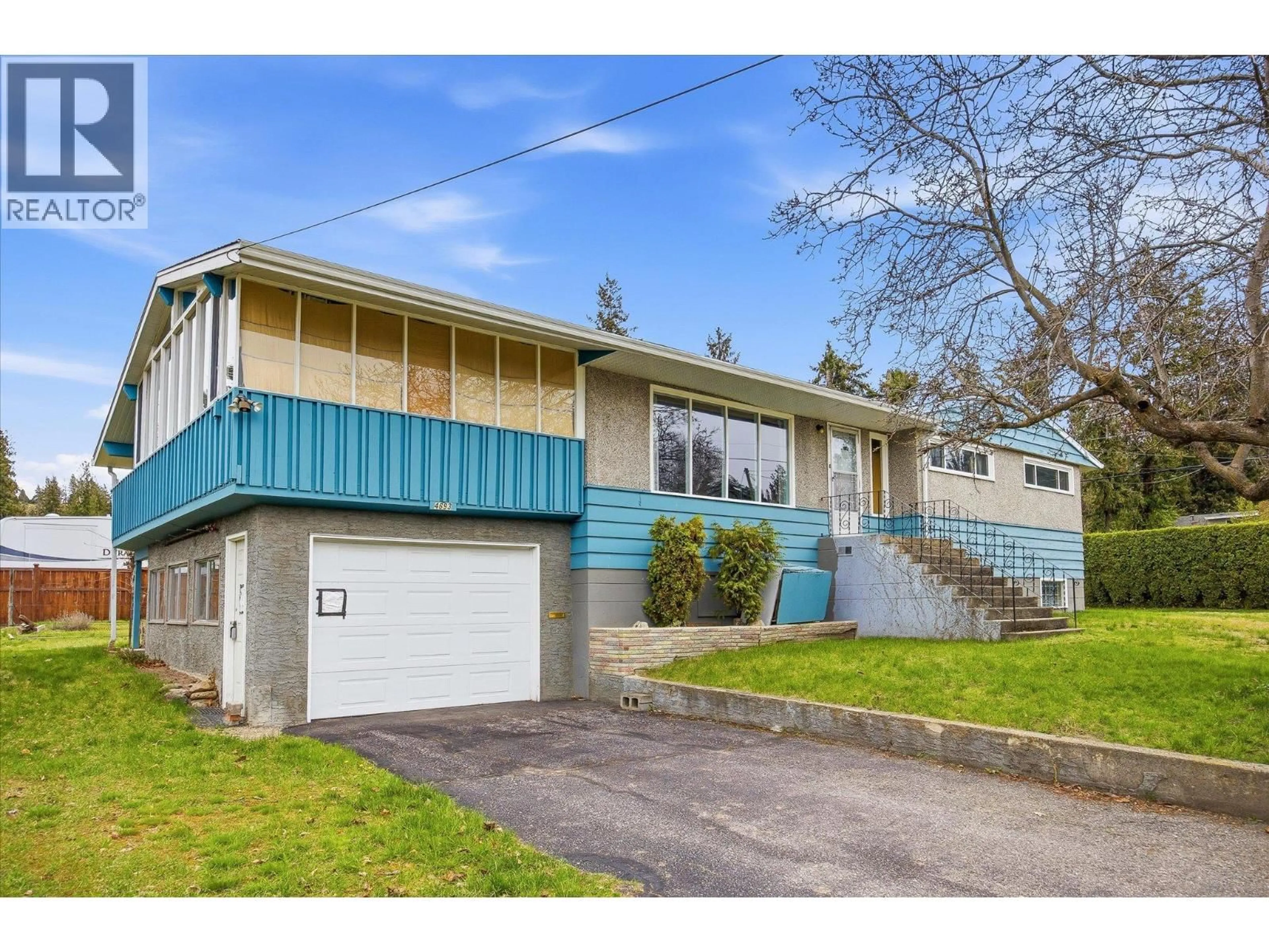 Home with vinyl exterior material, street for 4693 RAYMER ROAD, Kelowna British Columbia V1W1J4