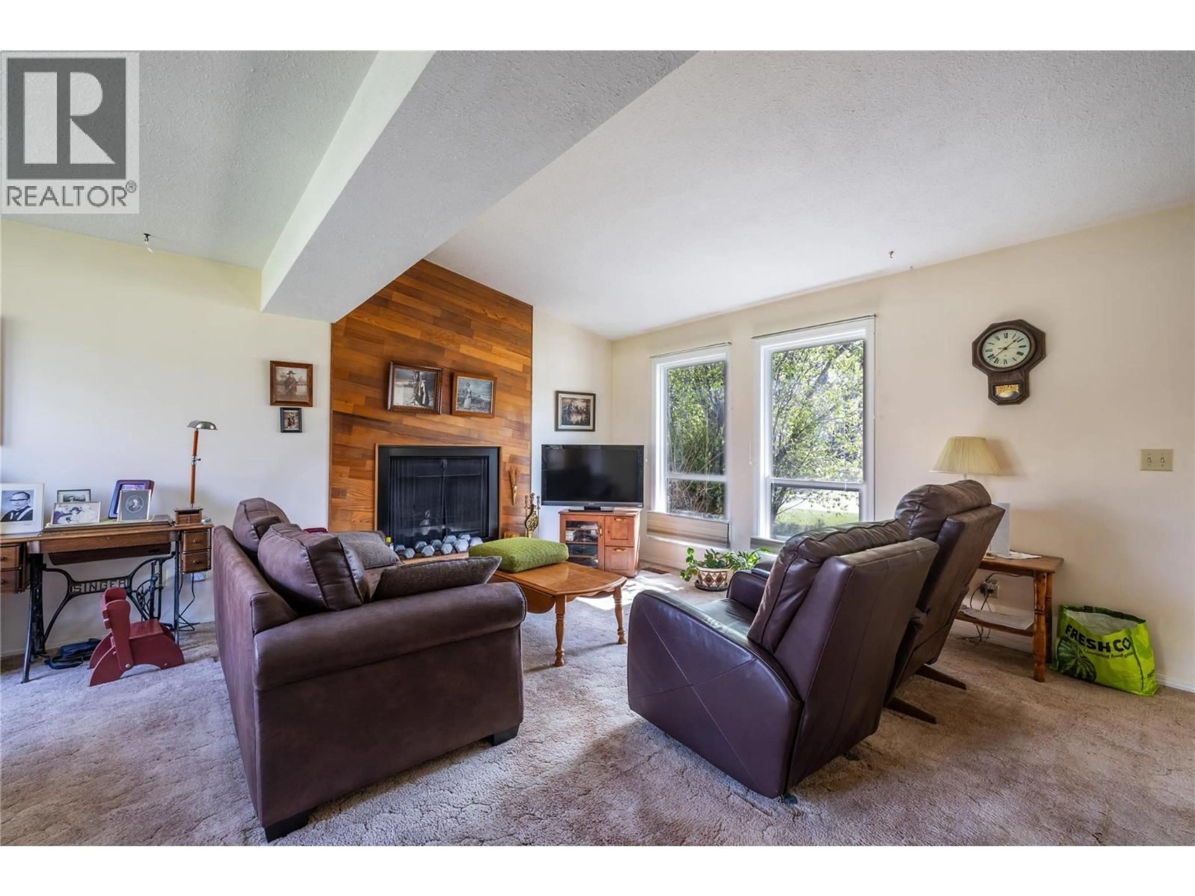 Living room with furniture, wood/laminate floor for 142 WHISTLER DRIVE, Kamloops British Columbia V2X1X6