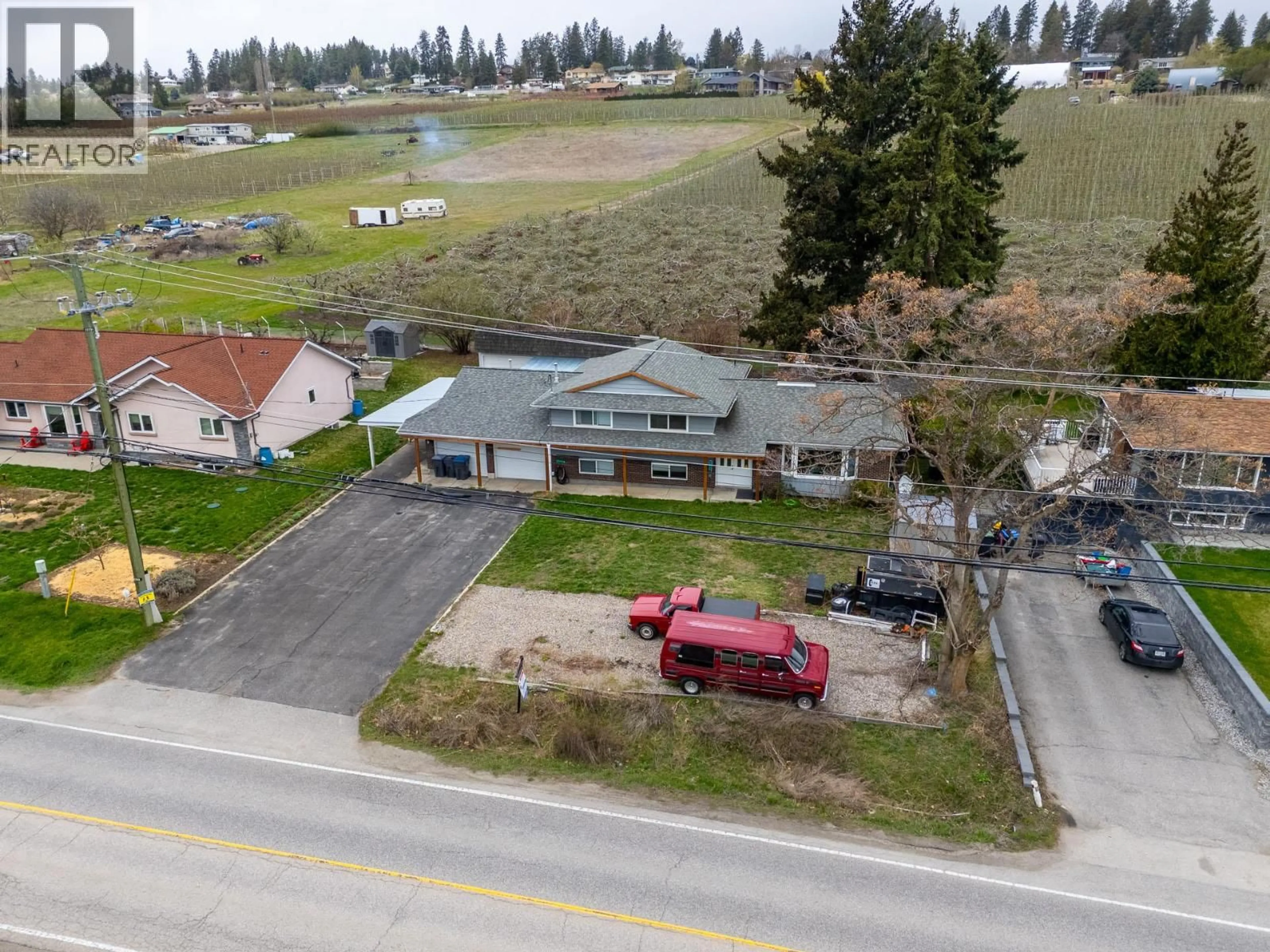 A pic from outside/outdoor area/front of a property/back of a property/a pic from drone, unknown for 11438 OKANAGAN CENTRE ROAD EAST, Lake Country British Columbia V4V1G7