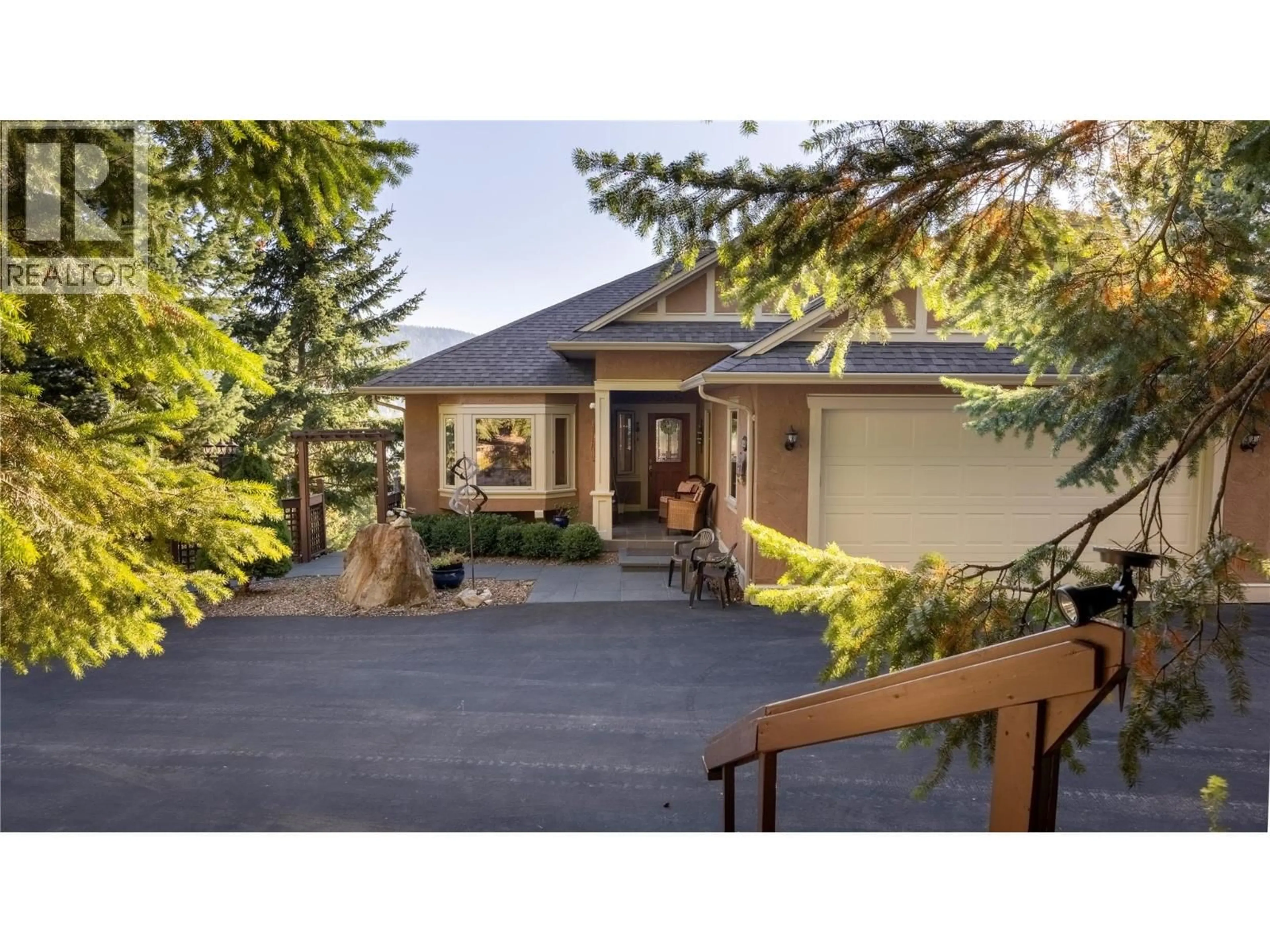 Home with vinyl exterior material, street for 8215 SILVER STAR ROAD, Vernon British Columbia V1B3M8