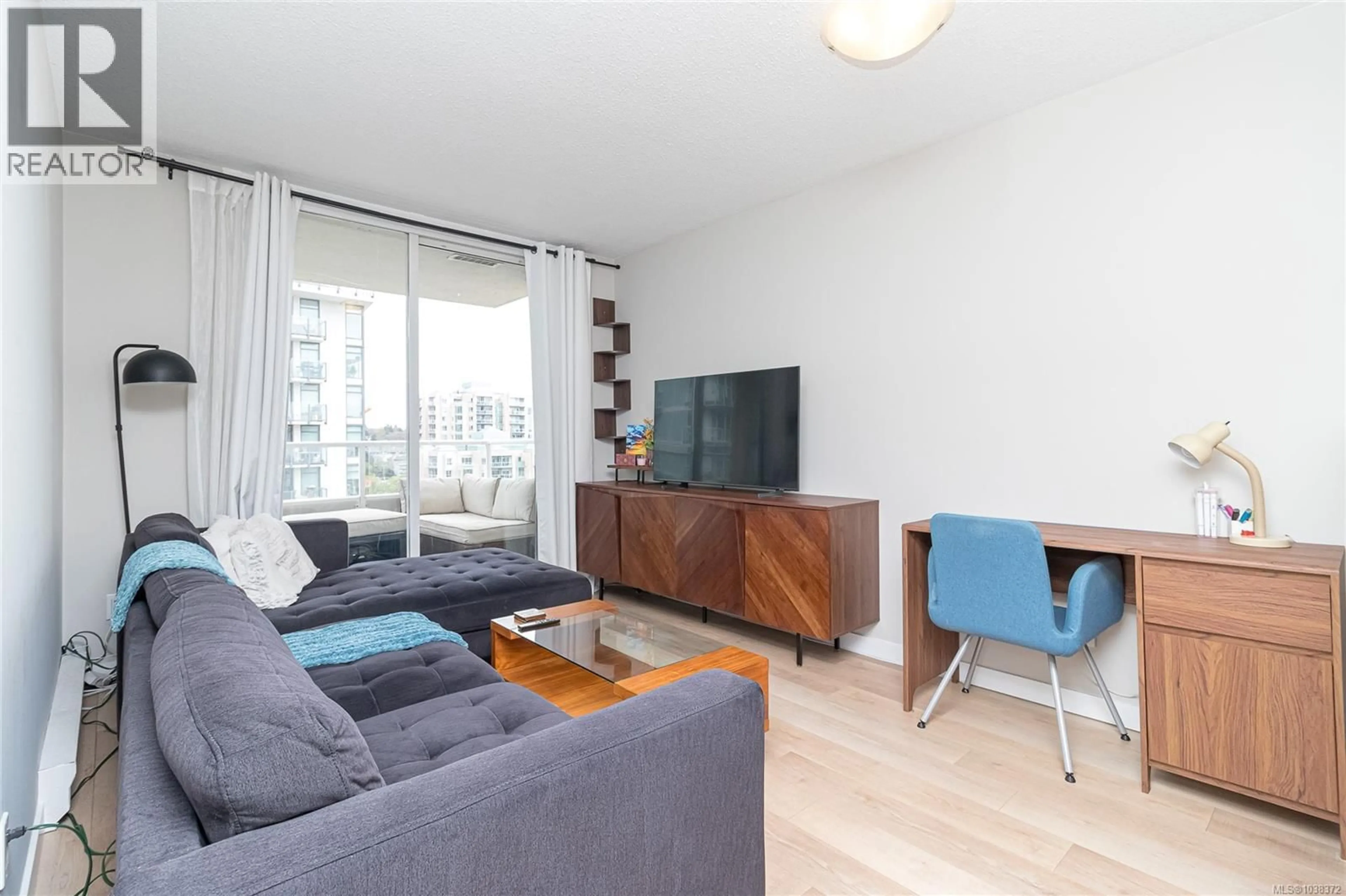 Living room with furniture, wood/laminate floor for 1203 - 930 YATES STREET, Victoria British Columbia V8V3M2