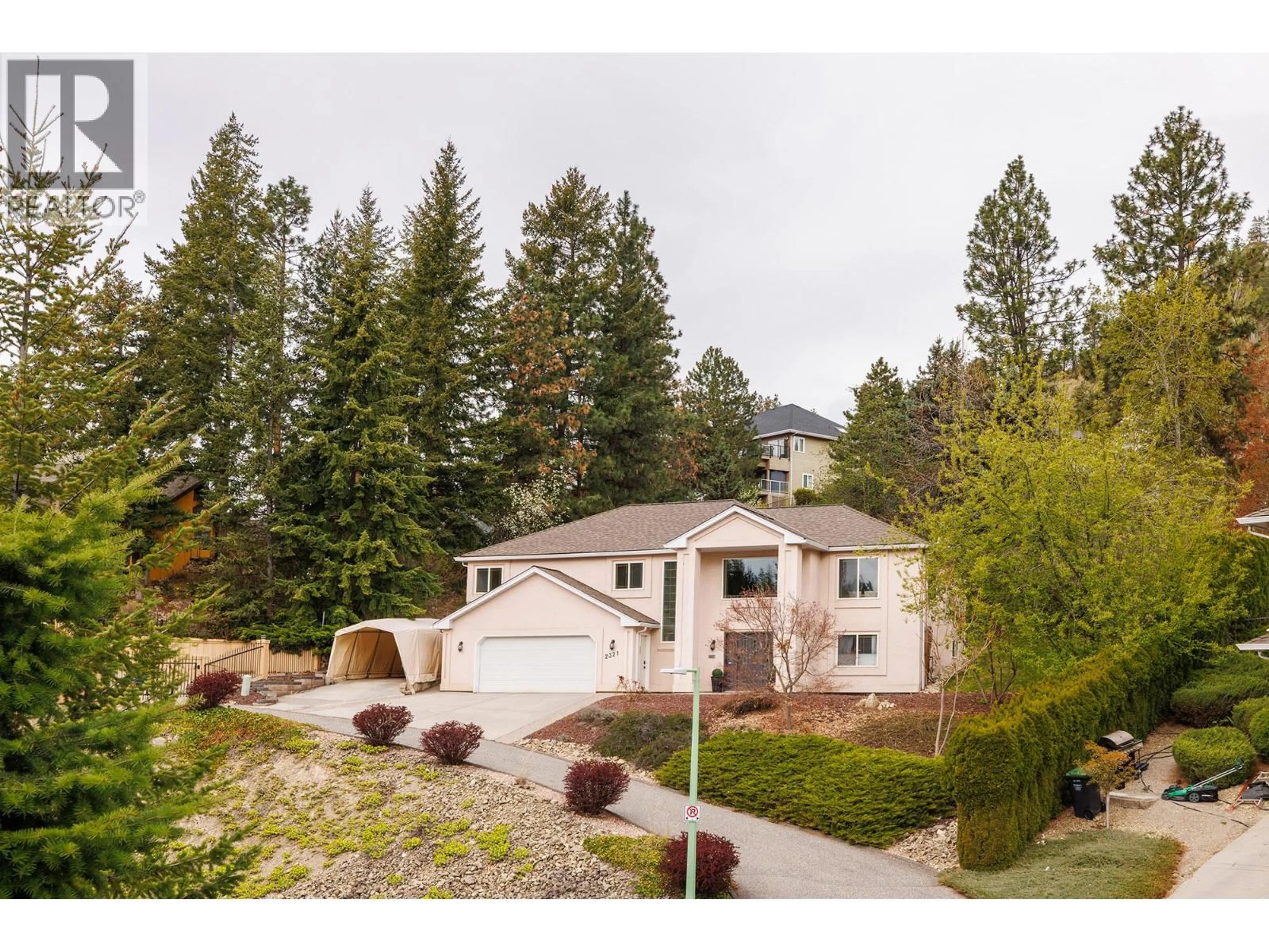 A pic from outside/outdoor area/front of a property/back of a property/a pic from drone, mountain view for 2321 LILLOOET CRESCENT, Kelowna British Columbia V1V1T1