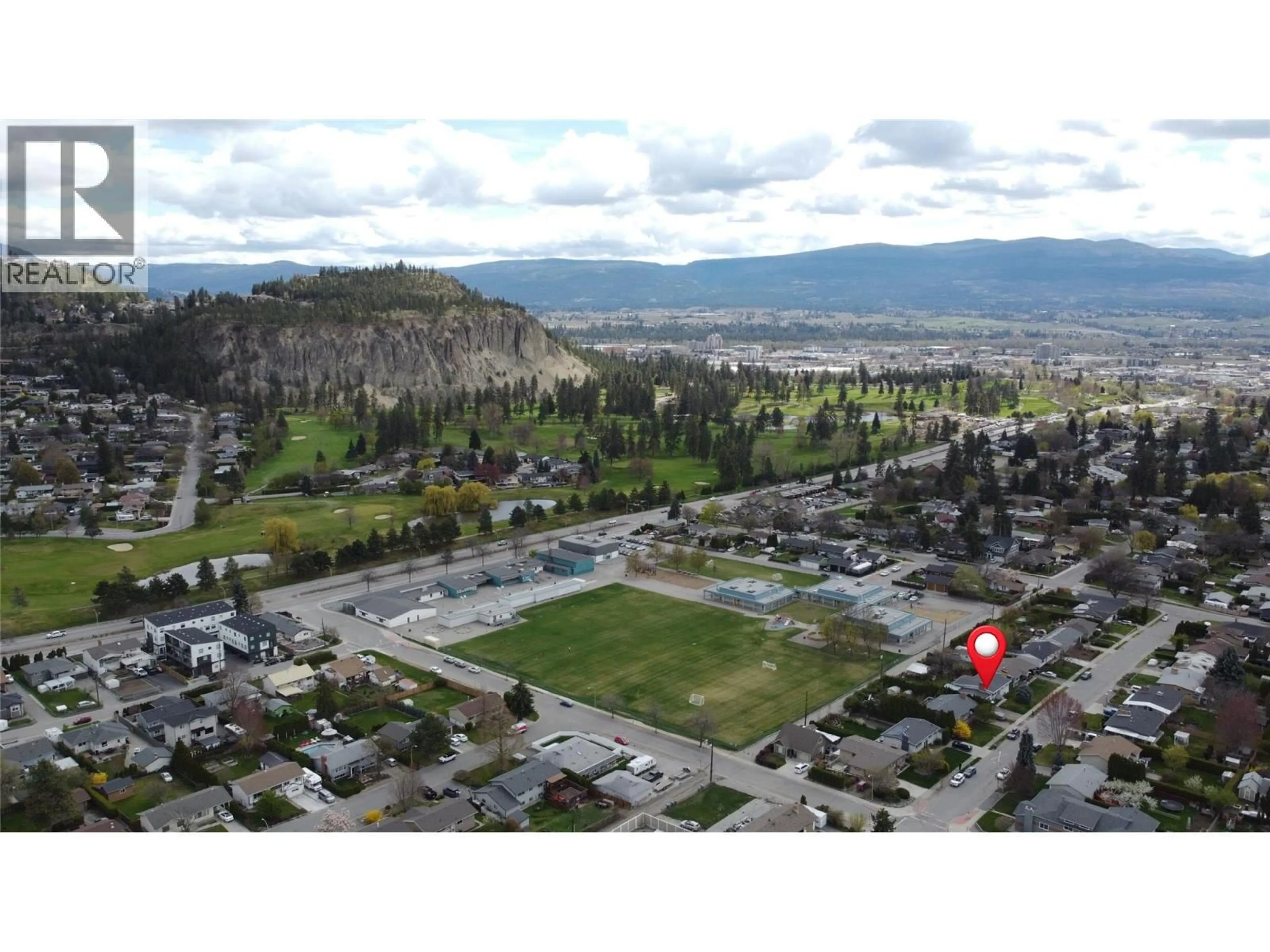 A pic from outside/outdoor area/front of a property/back of a property/a pic from drone, mountain view for 945 KENNEDY STREET, Kelowna British Columbia V1Y4E9