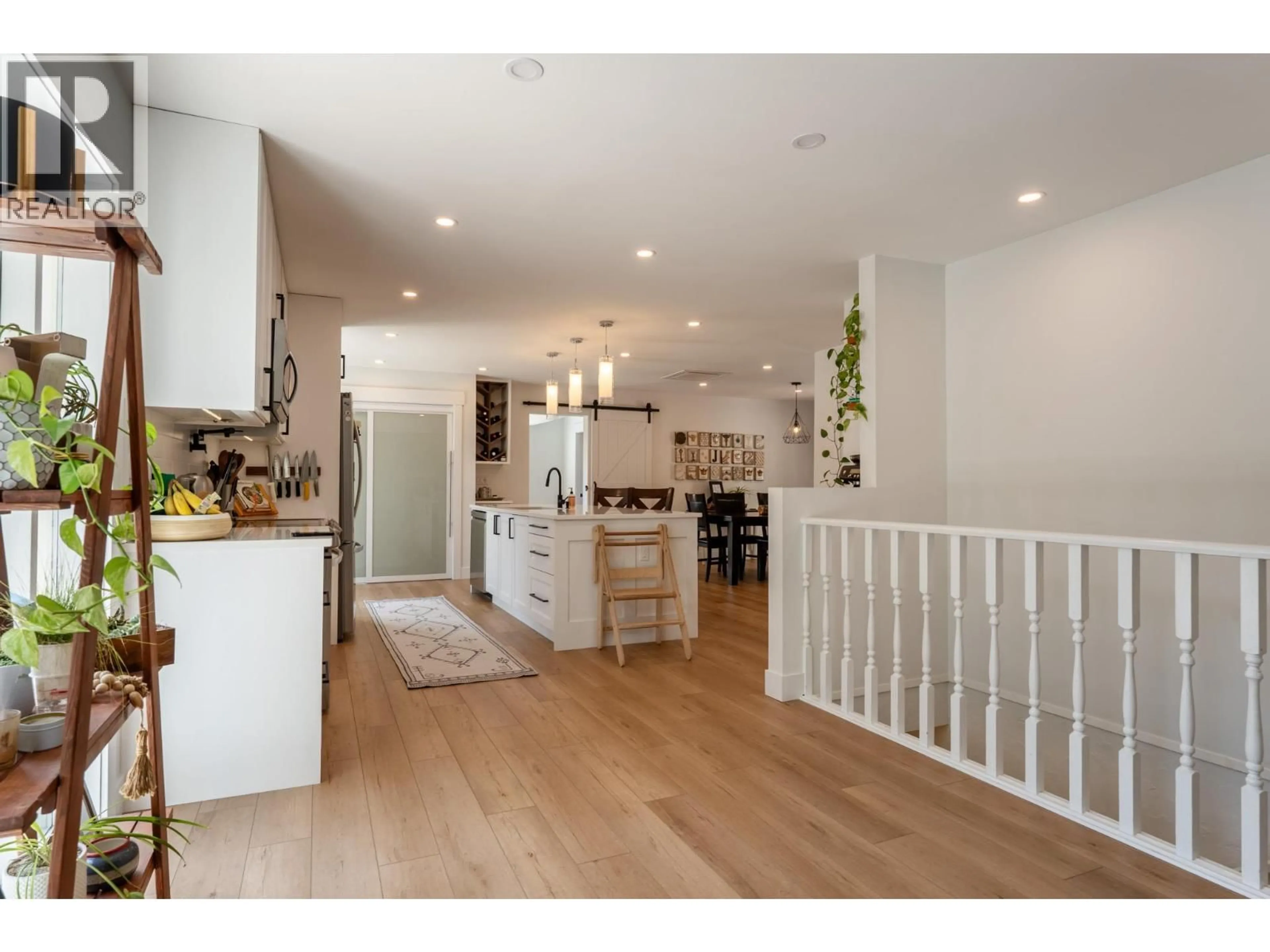 Open concept kitchen, wood/laminate floor for 400 CLIFTON ROAD, Kelowna British Columbia V1V1A5