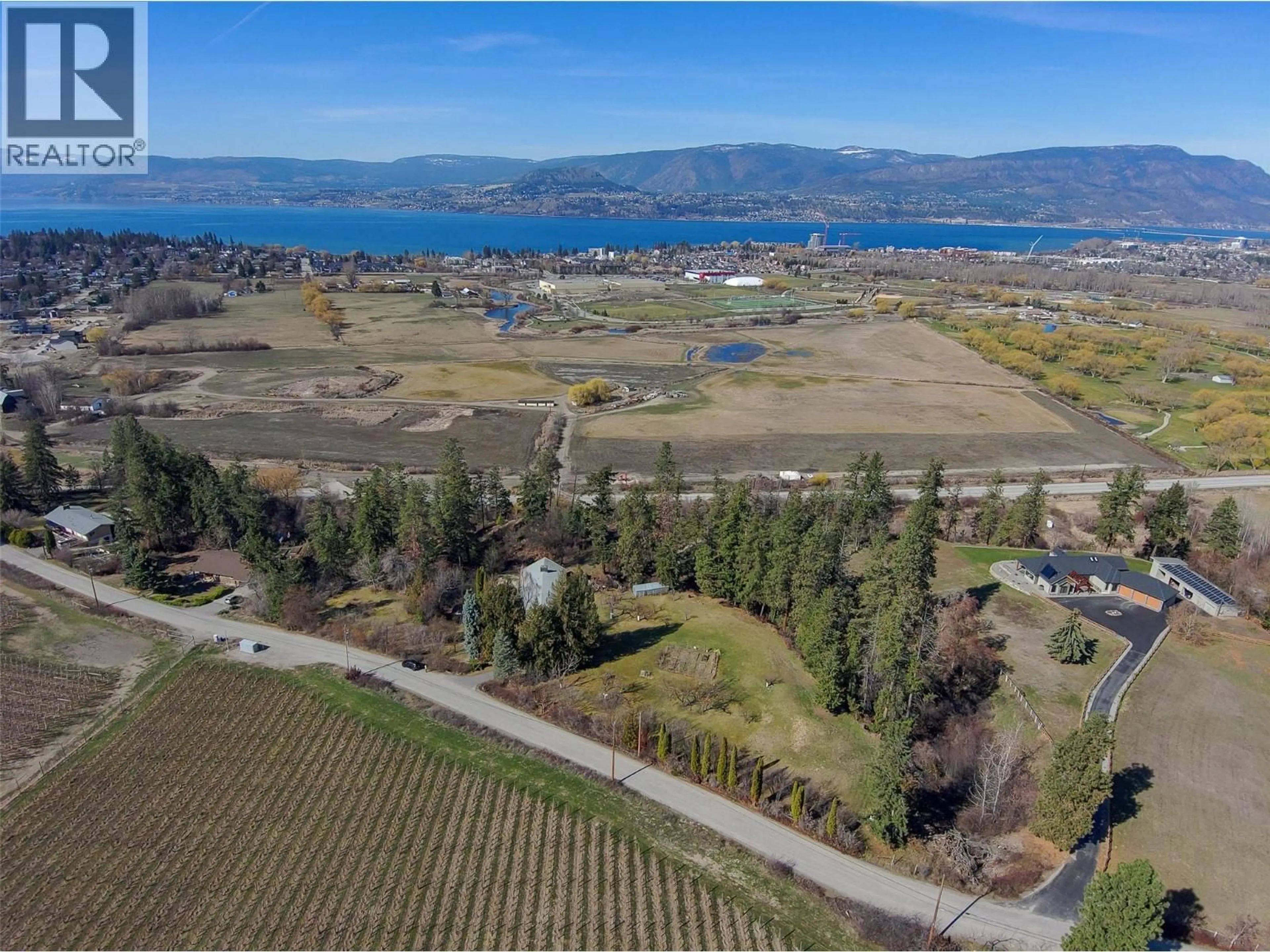 A pic from outside/outdoor area/front of a property/back of a property/a pic from drone, water/lake/river/ocean view for 4150 HUGHES ROAD, Kelowna British Columbia V1W4S3