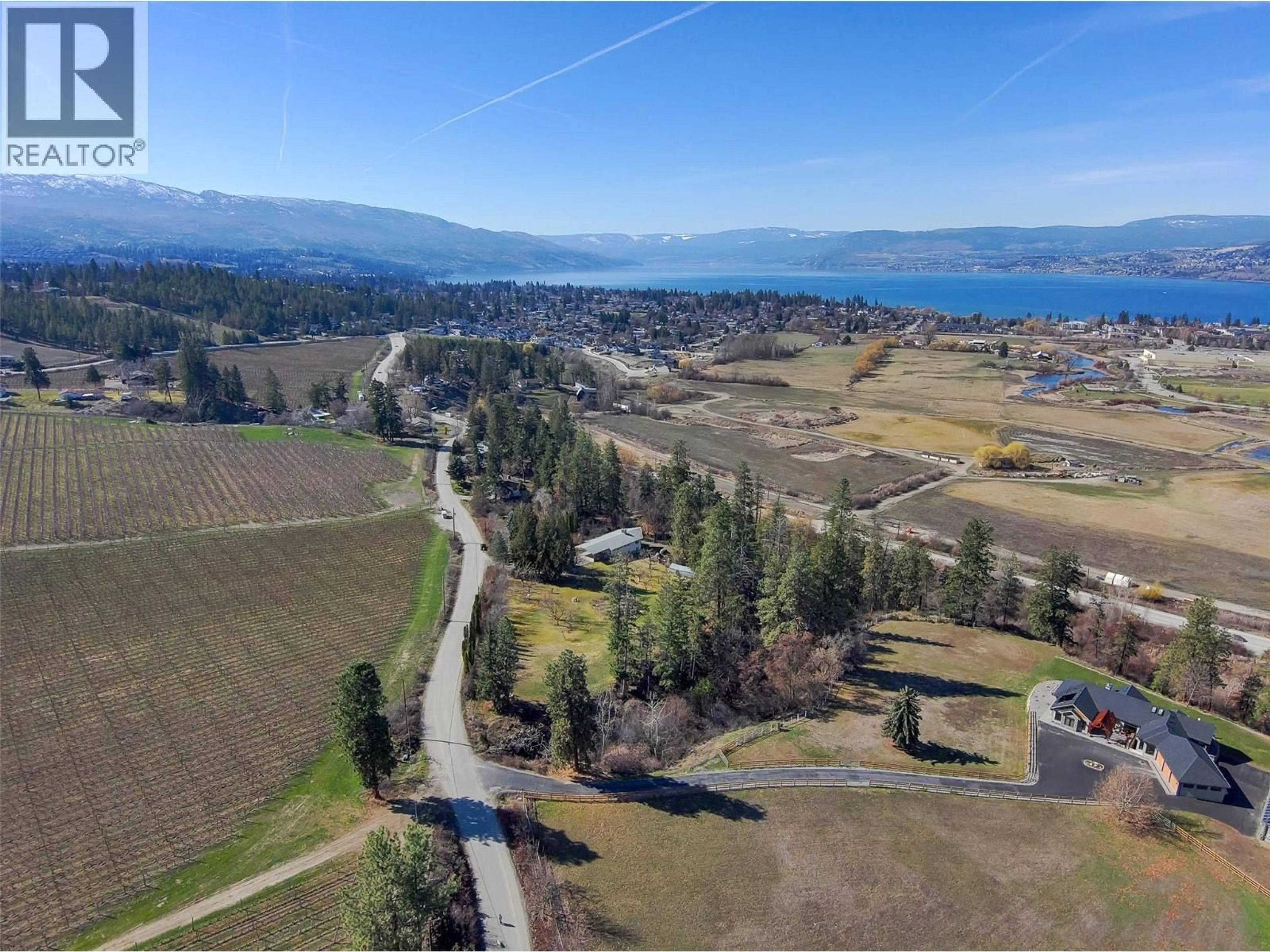 A pic from outside/outdoor area/front of a property/back of a property/a pic from drone, water/lake/river/ocean view for 4150 HUGHES ROAD, Kelowna British Columbia V1W4S3