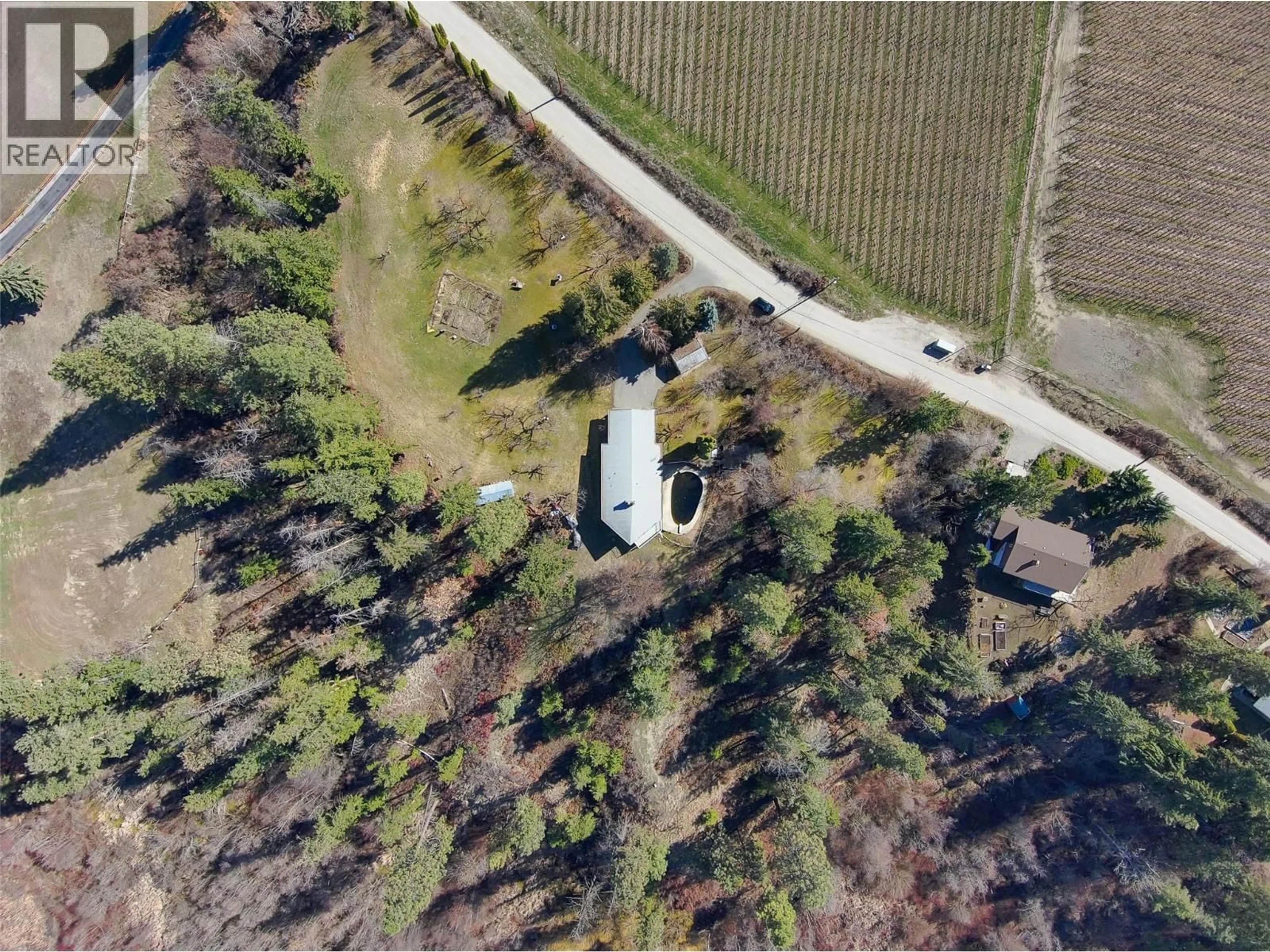 A pic from outside/outdoor area/front of a property/back of a property/a pic from drone, forest/trees view for 4150 HUGHES ROAD, Kelowna British Columbia V1W4S3