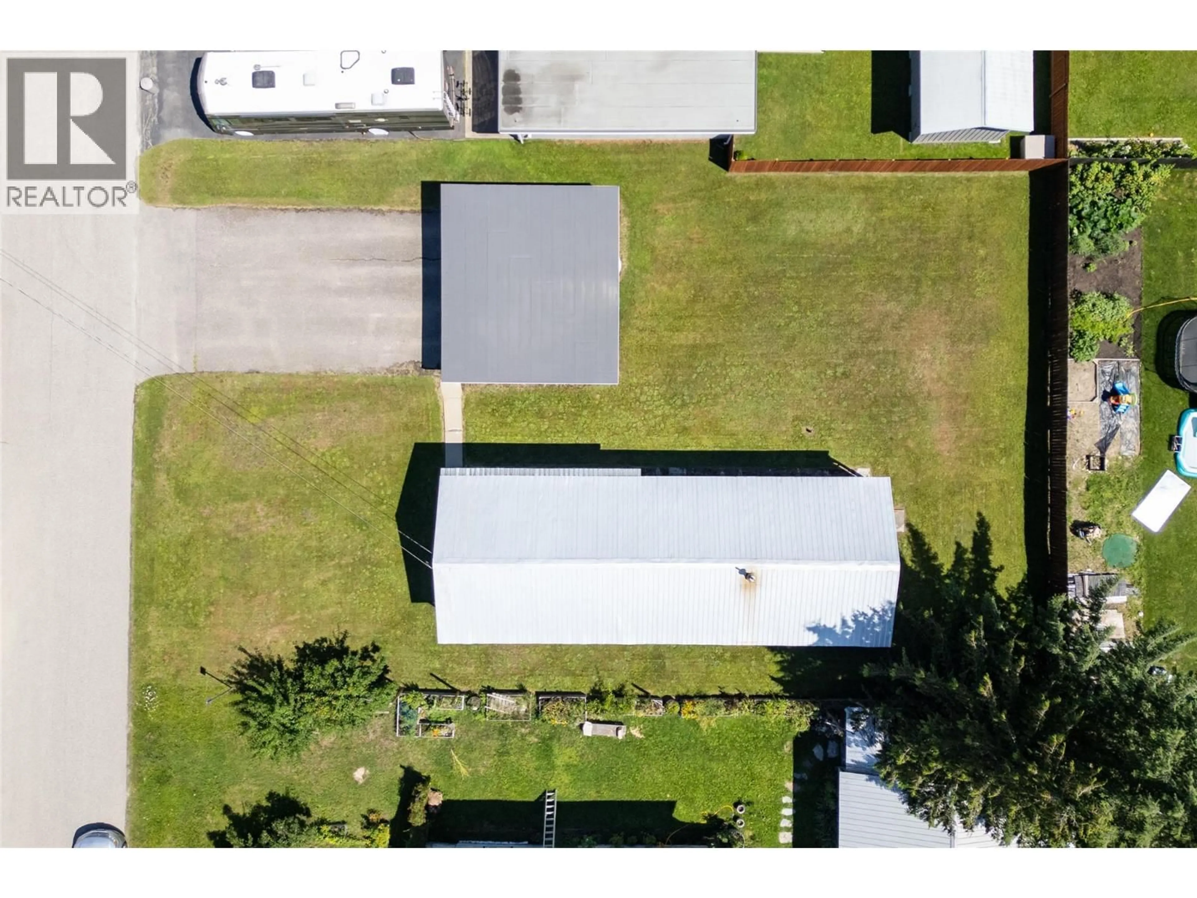 A pic from outside/outdoor area/front of a property/back of a property/a pic from drone, street for 802 CENTER STREET, Revelstoke British Columbia V0E2S0