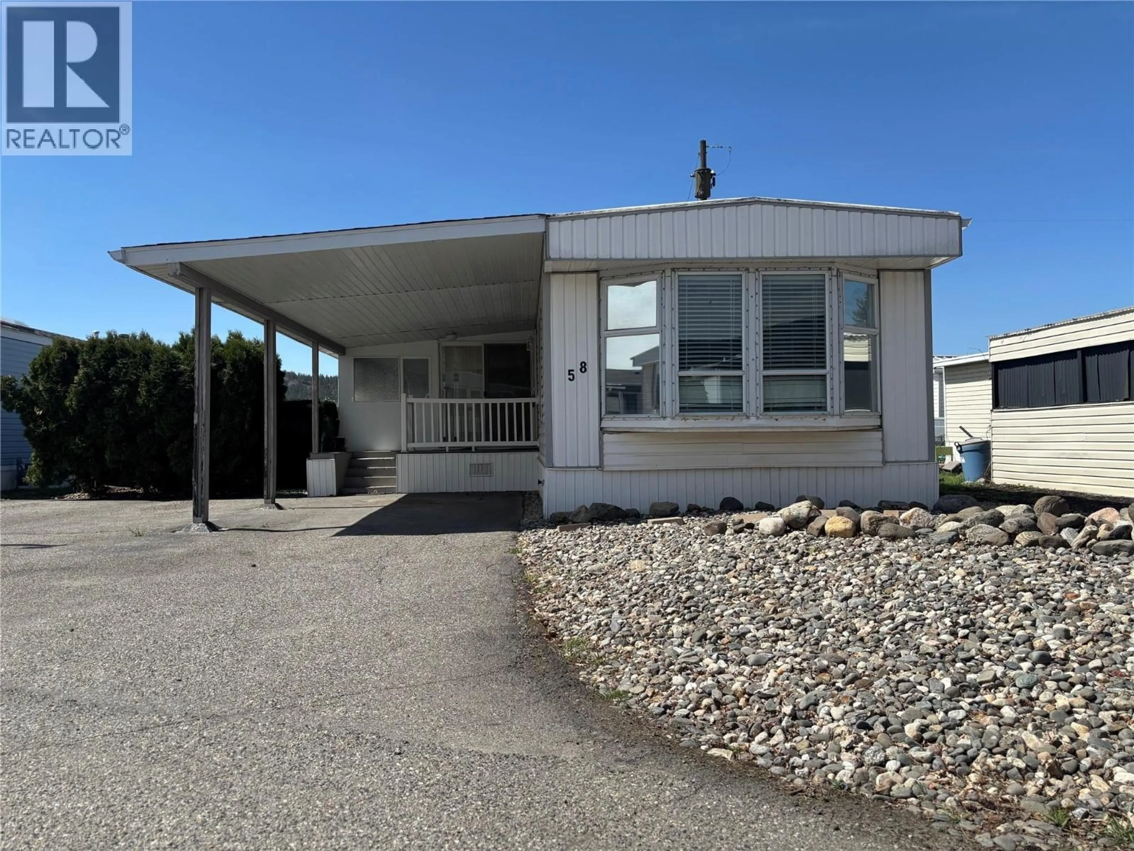 Home with vinyl exterior material, street for 58 - 9020 JIM BAILEY ROAD, Kelowna British Columbia V4V1E5