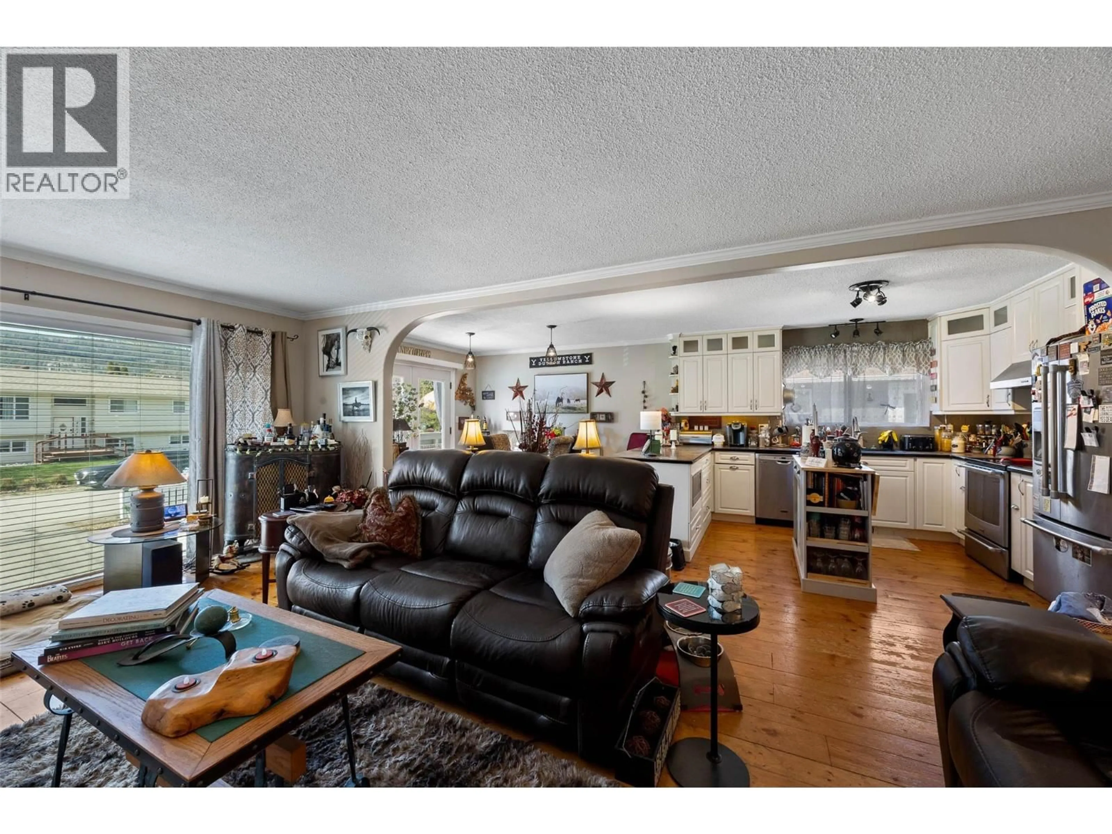 Open concept kitchen, wood/laminate floor for 4602 STRAWBERRY LANE, Kamloops British Columbia V2H1L6