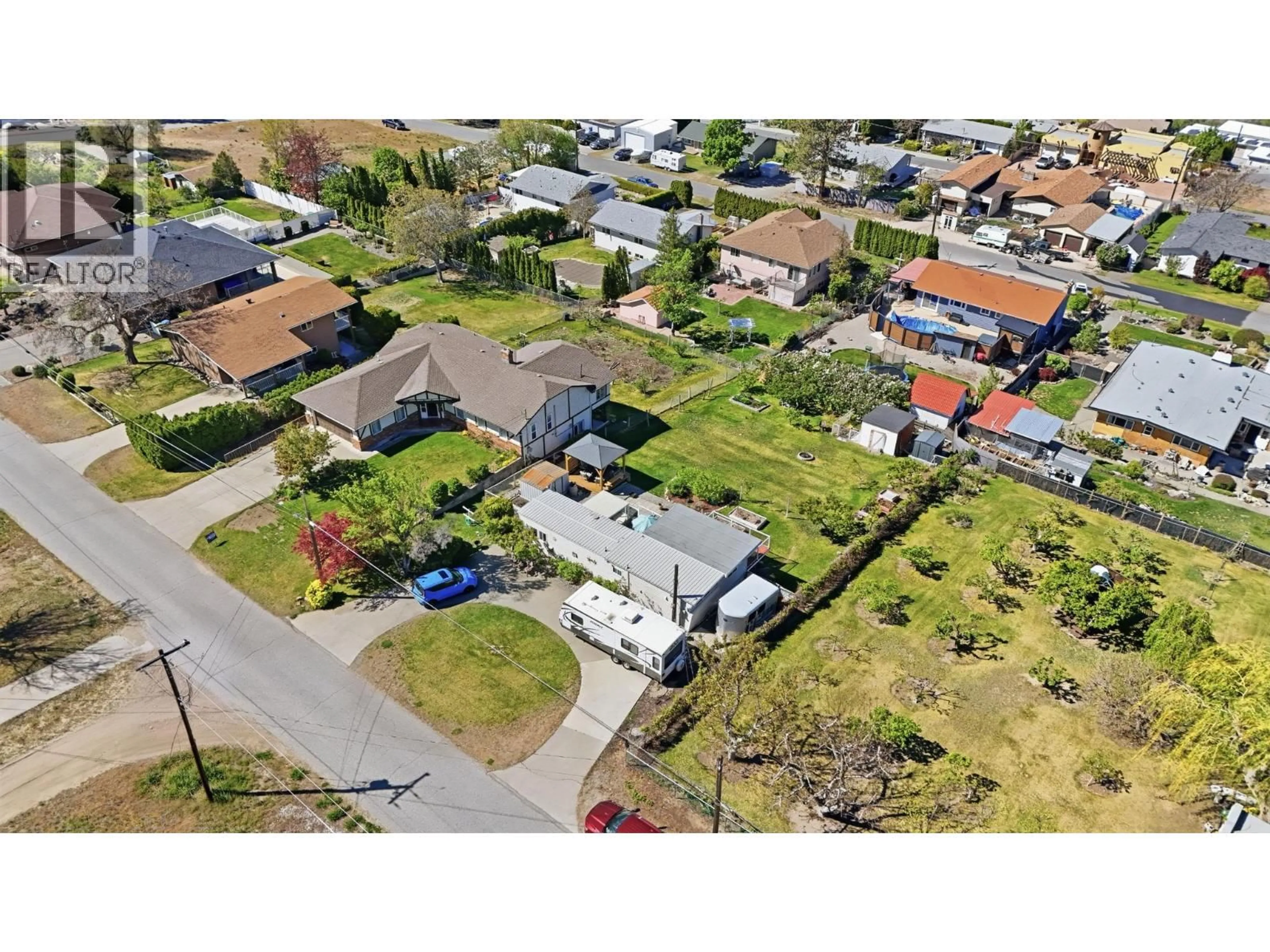 A pic from outside/outdoor area/front of a property/back of a property/a pic from drone, street for 3832 33RD STREET, Osoyoos British Columbia V0H1V6