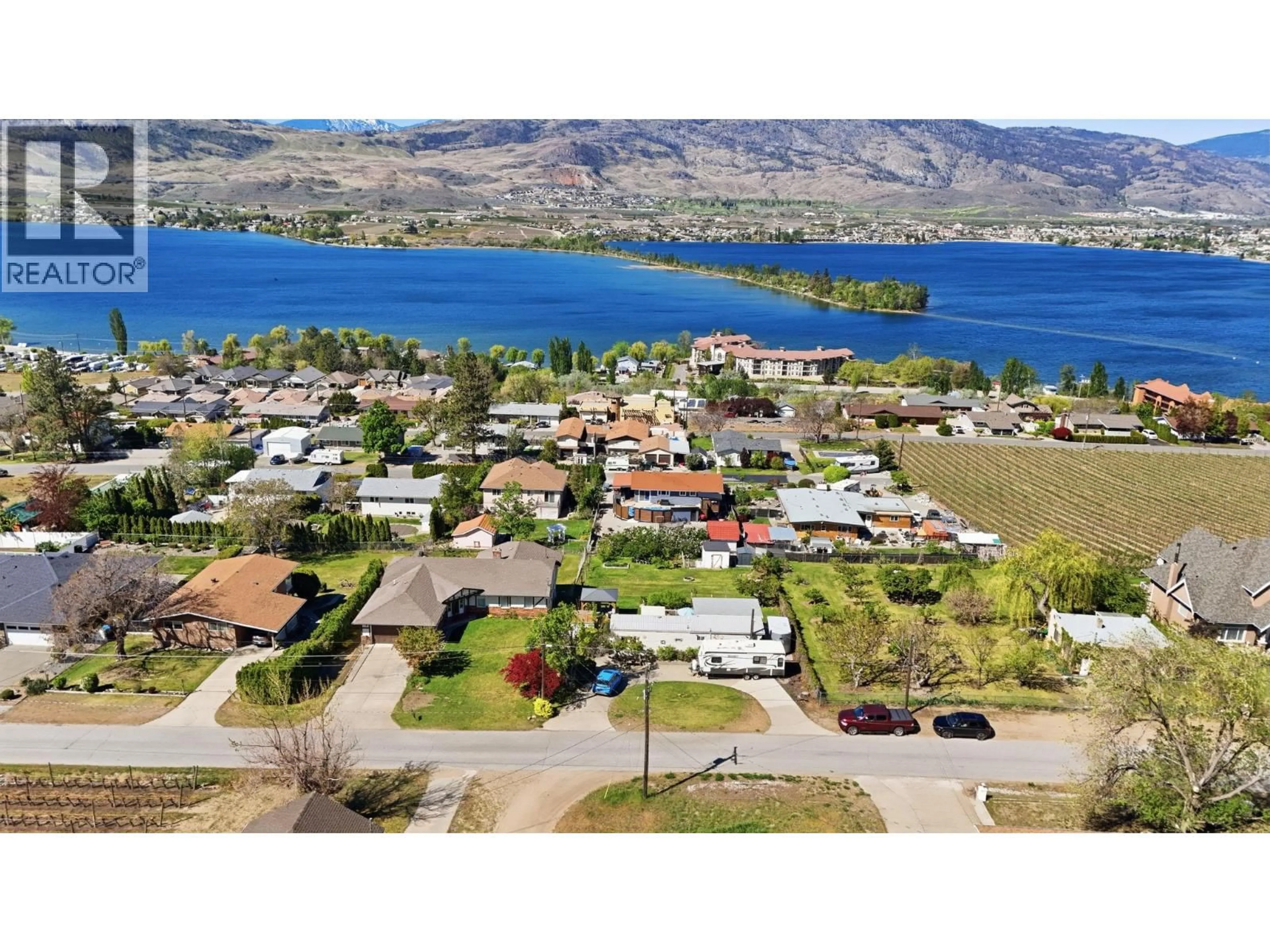 A pic from outside/outdoor area/front of a property/back of a property/a pic from drone, water/lake/river/ocean view for 3832 33RD STREET, Osoyoos British Columbia V0H1V6