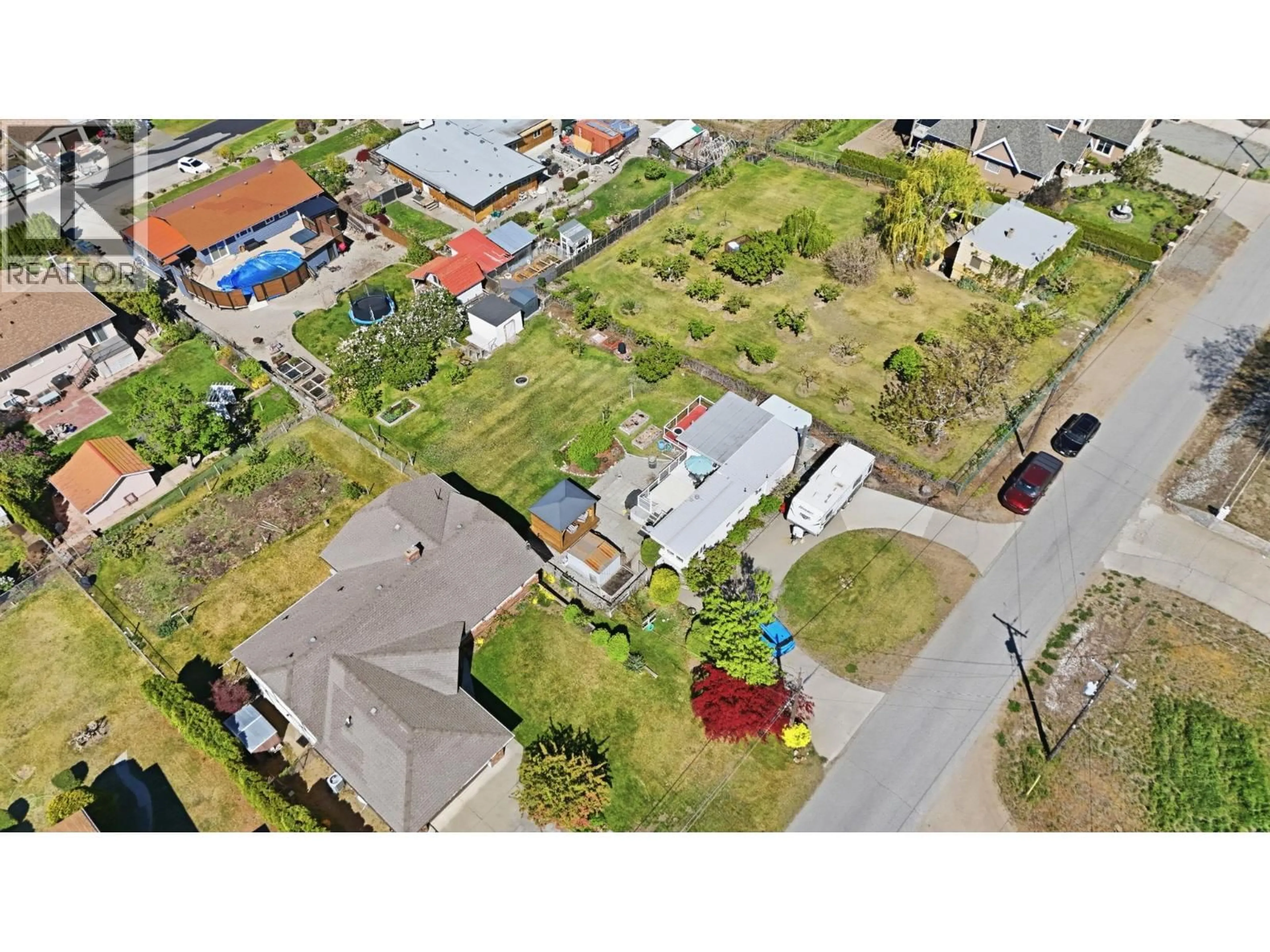 A pic from outside/outdoor area/front of a property/back of a property/a pic from drone, street for 3832 33RD STREET, Osoyoos British Columbia V0H1V6