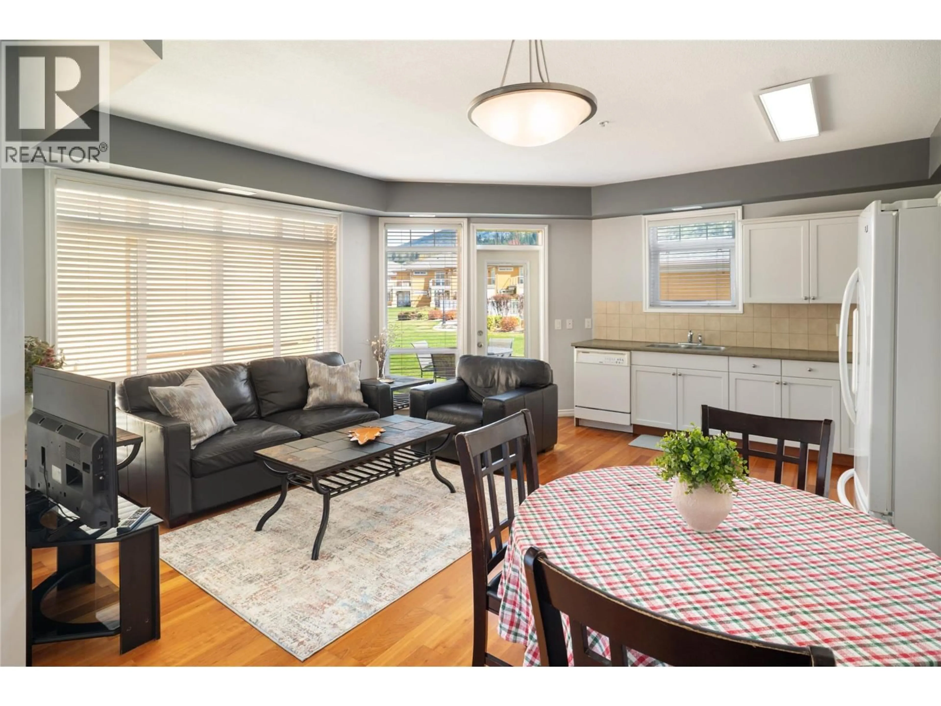 Open concept kitchen, wood/laminate floor for 109 - 3570 WOODSDALE ROAD, Lake Country British Columbia V4V1Y9