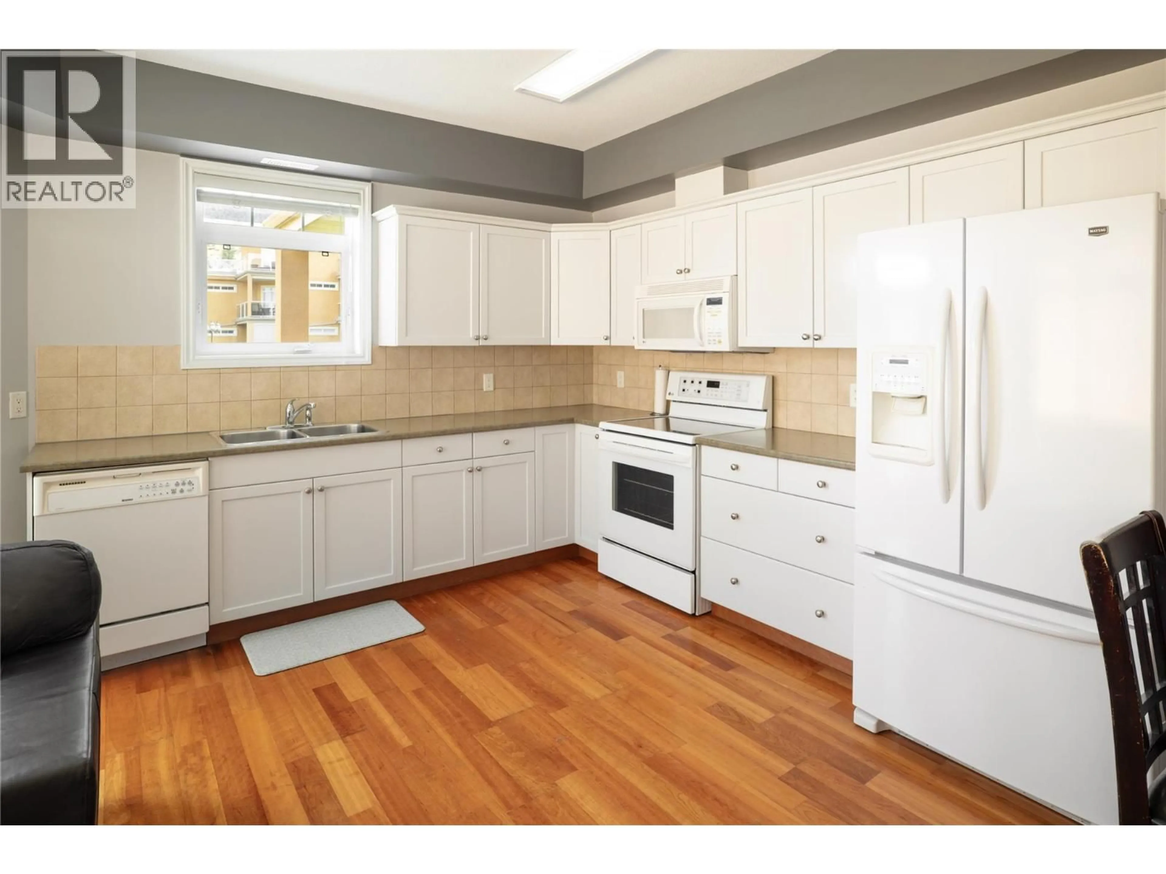 Standard kitchen, wood/laminate floor for 109 - 3570 WOODSDALE ROAD, Lake Country British Columbia V4V1Y9