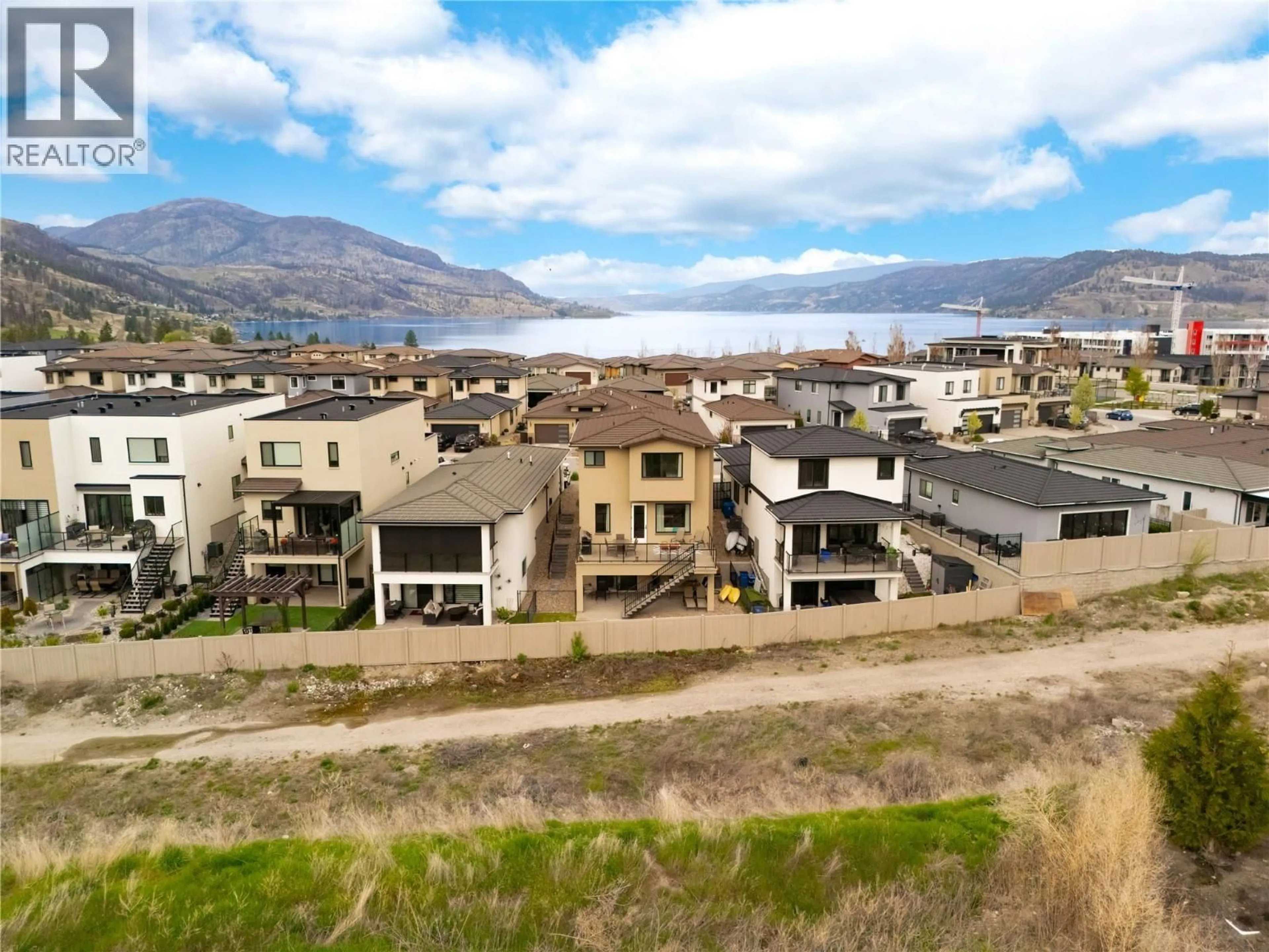 A pic from outside/outdoor area/front of a property/back of a property/a pic from drone, mountain view for 1876 VIEWPOINT CRESCENT, Kelowna British Columbia V1Z4E1