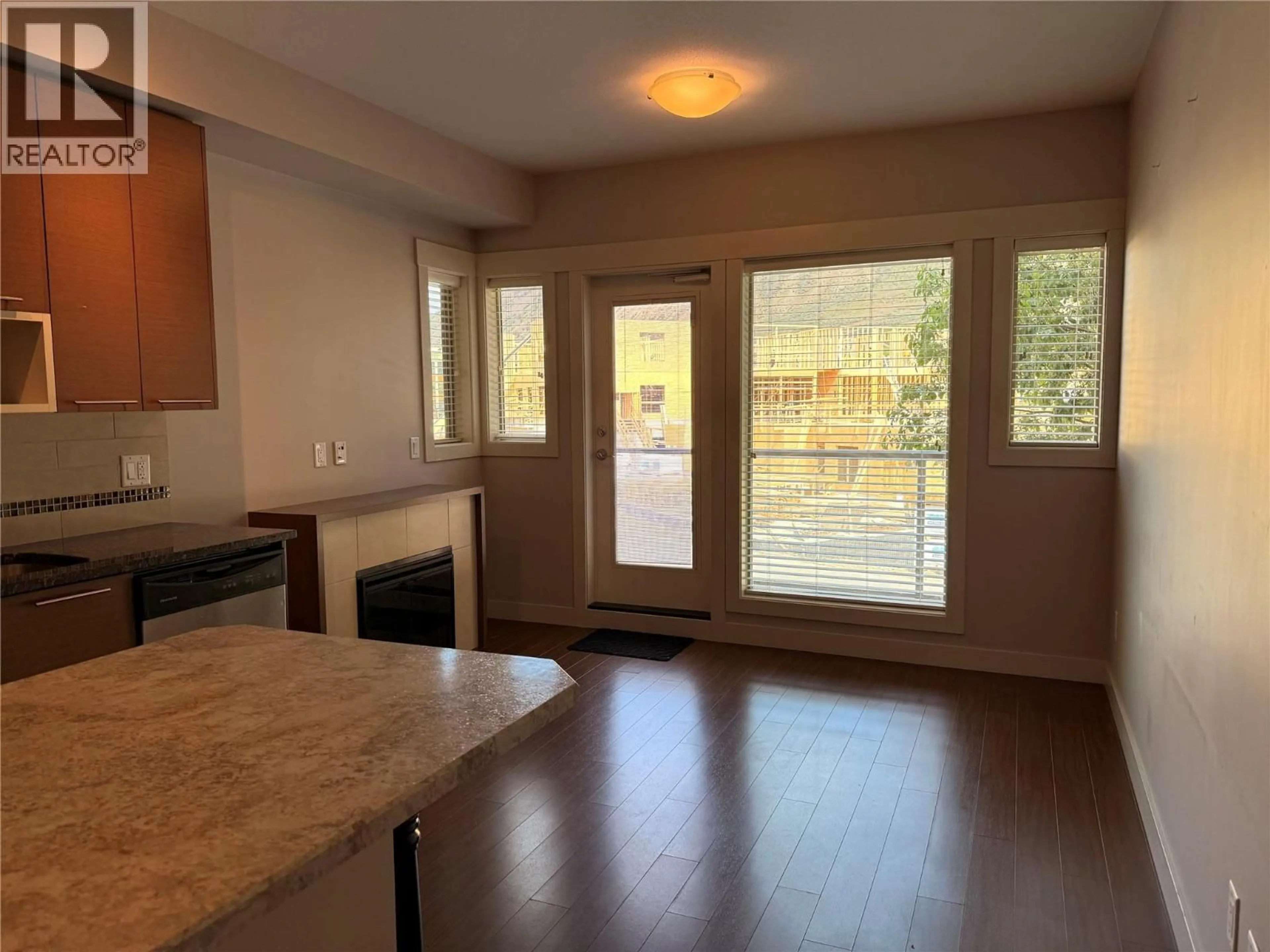 Open concept kitchen, wood/laminate floor for 3202 - 1040 TALASA COURT, Kamloops British Columbia V2H0C4