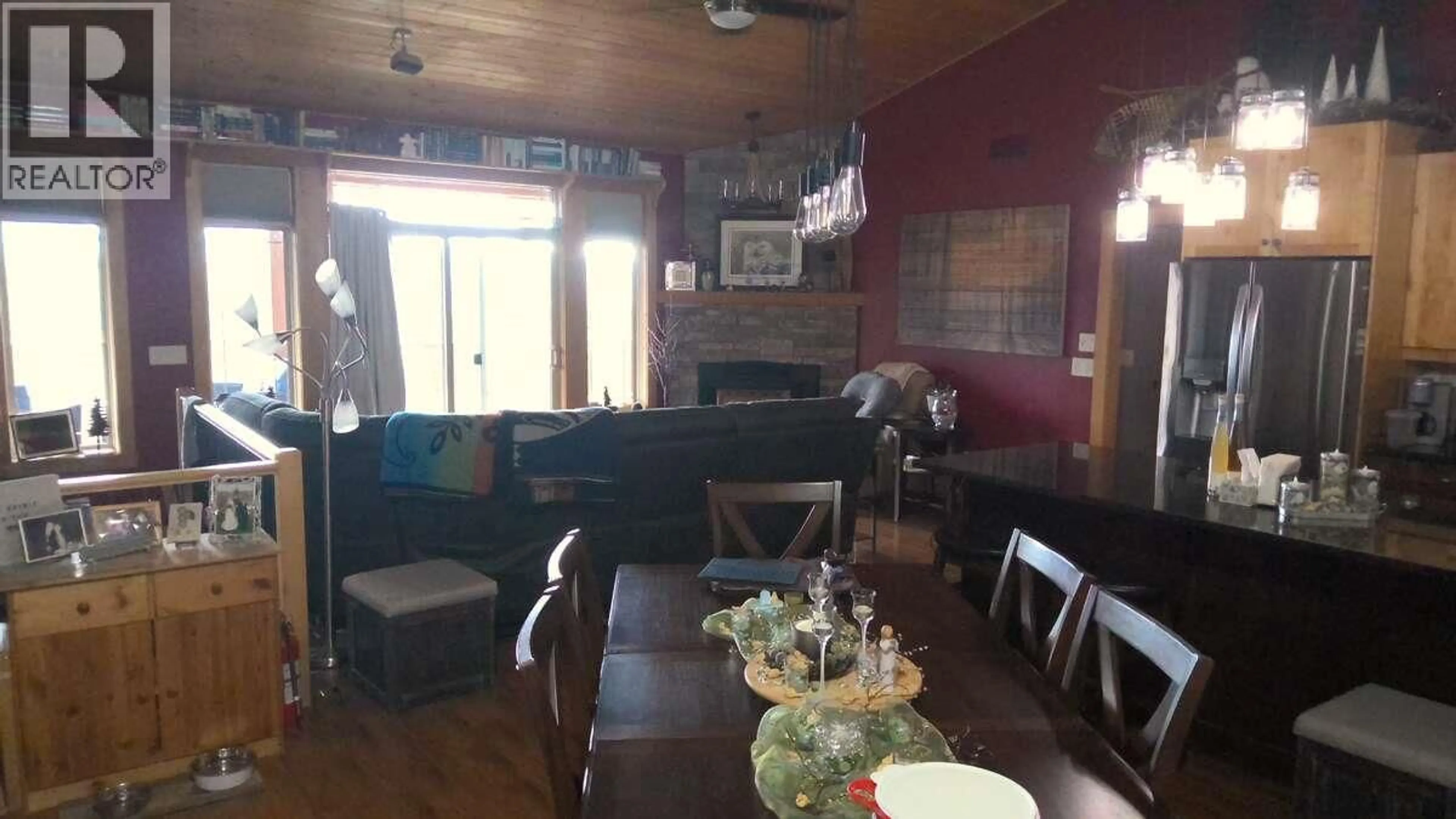 Dining room, wood/laminate floor for 7080 SUN VALLEY ROAD, Kelowna British Columbia V1P1H4