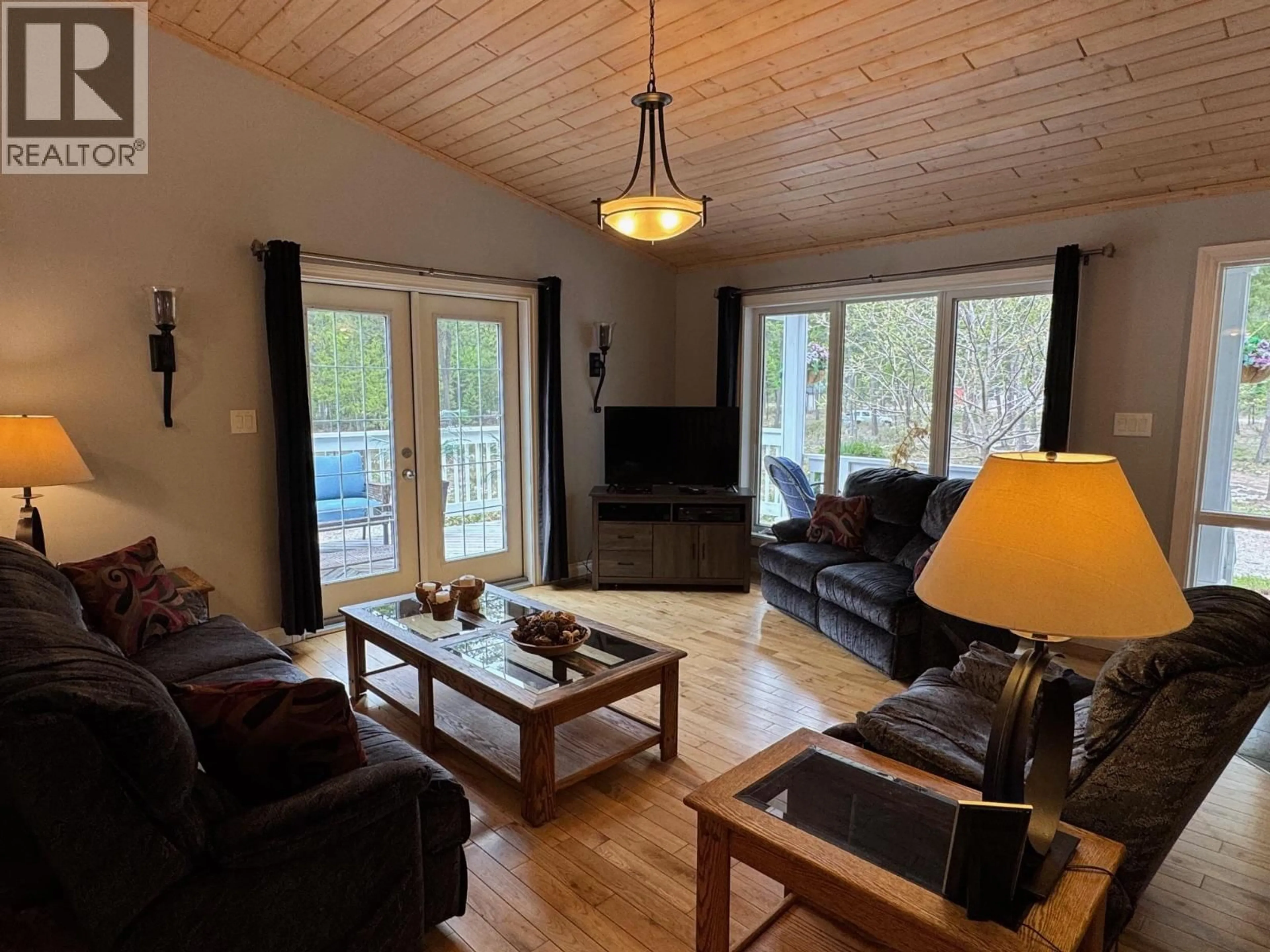 Living room with furniture, wood/laminate floor for 5 COTTONWOOD ROAD, Beaverdell British Columbia V0H1A0