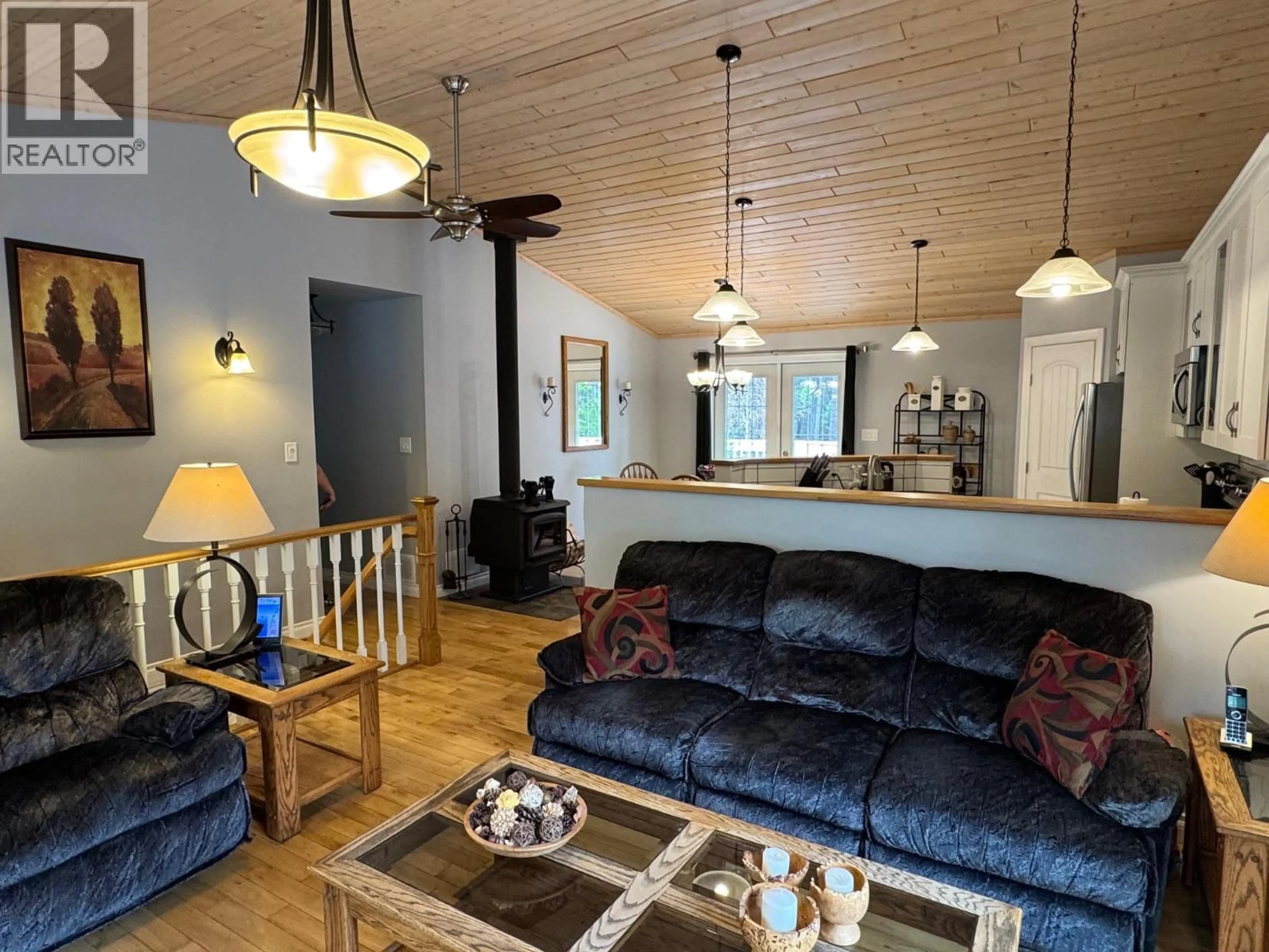 Living room with furniture, wood/laminate floor for 5 COTTONWOOD ROAD, Beaverdell British Columbia V0H1A0