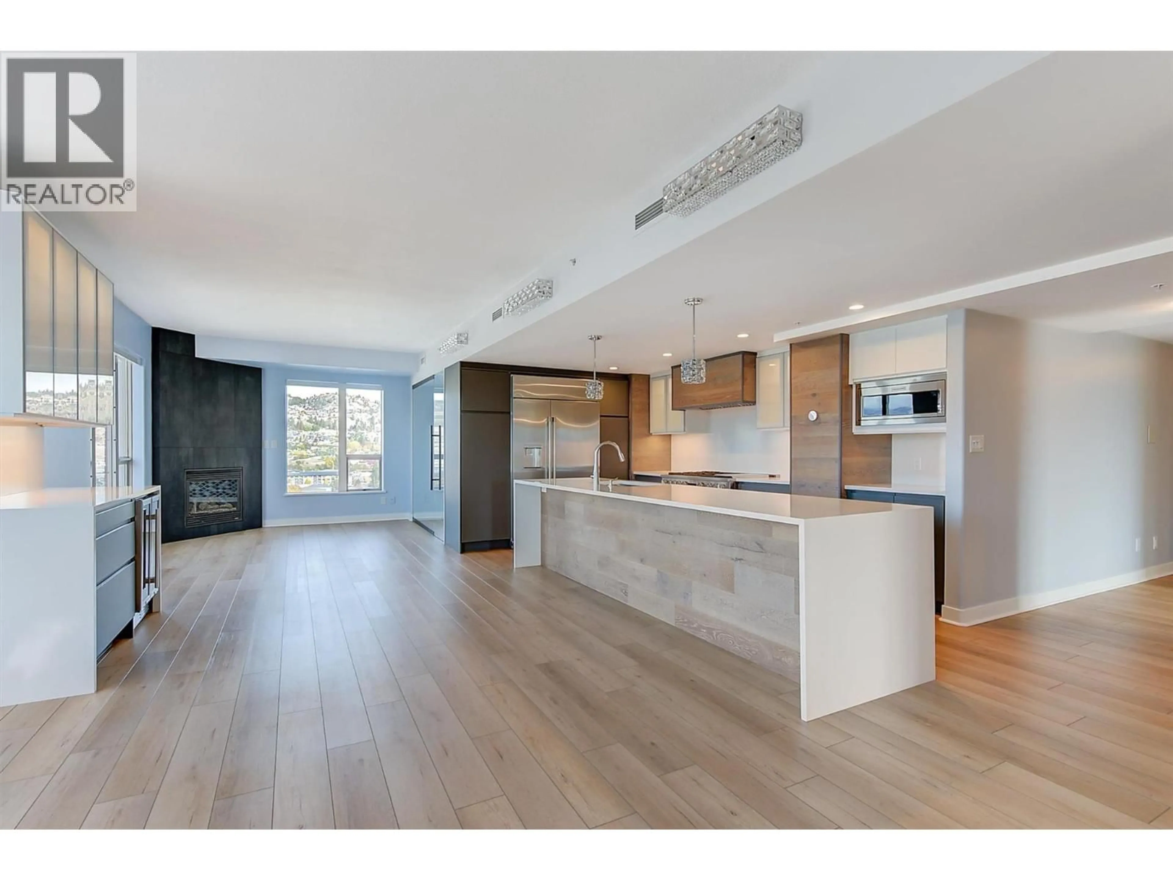 Open concept kitchen, wood/laminate floor for 1209 - 1160 BERNARD AVENUE, Kelowna British Columbia V1Y6R2