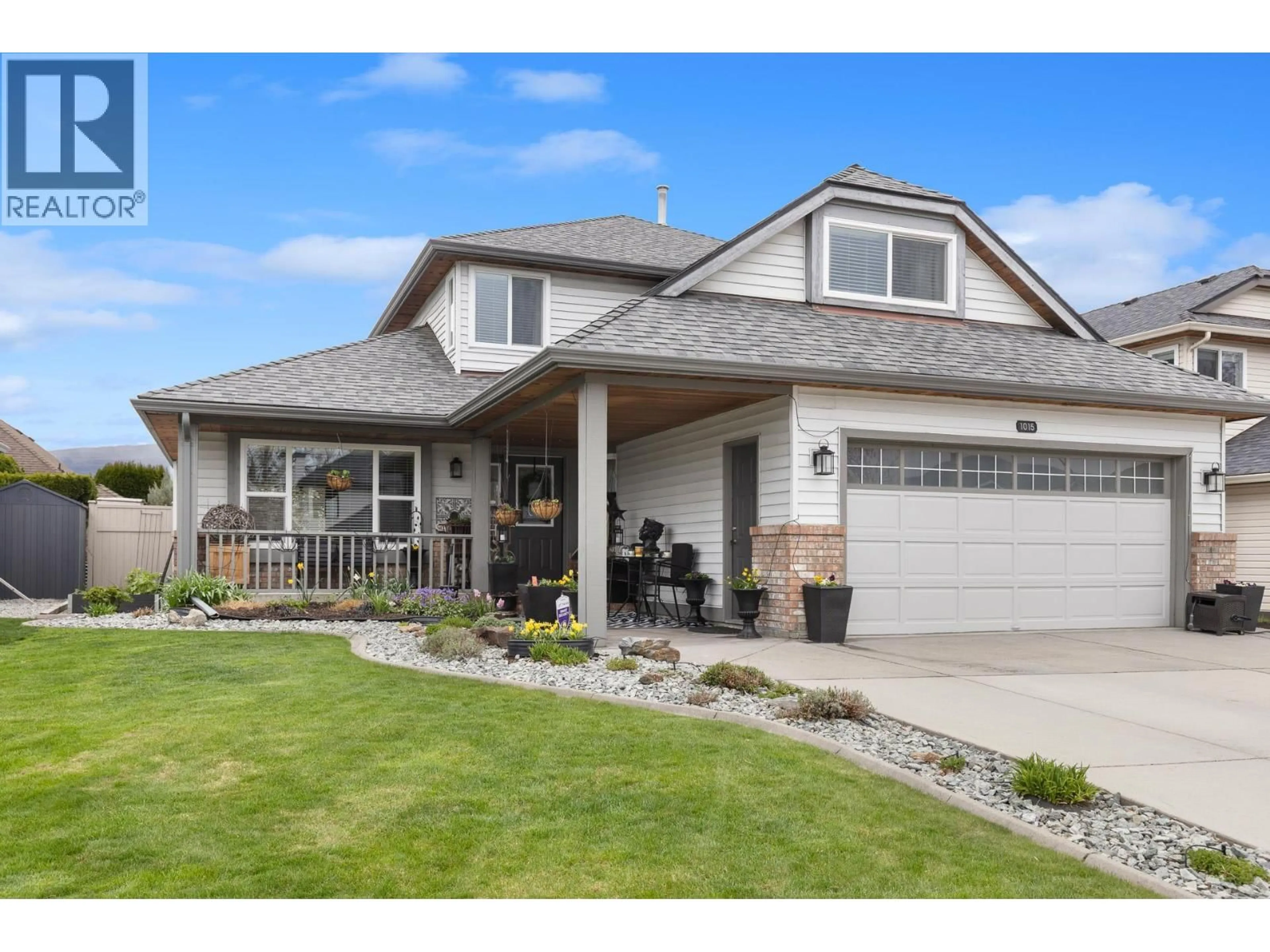 Home with vinyl exterior material, street for 1015 WINTERGREEN DRIVE, Kelowna British Columbia V1W3V7