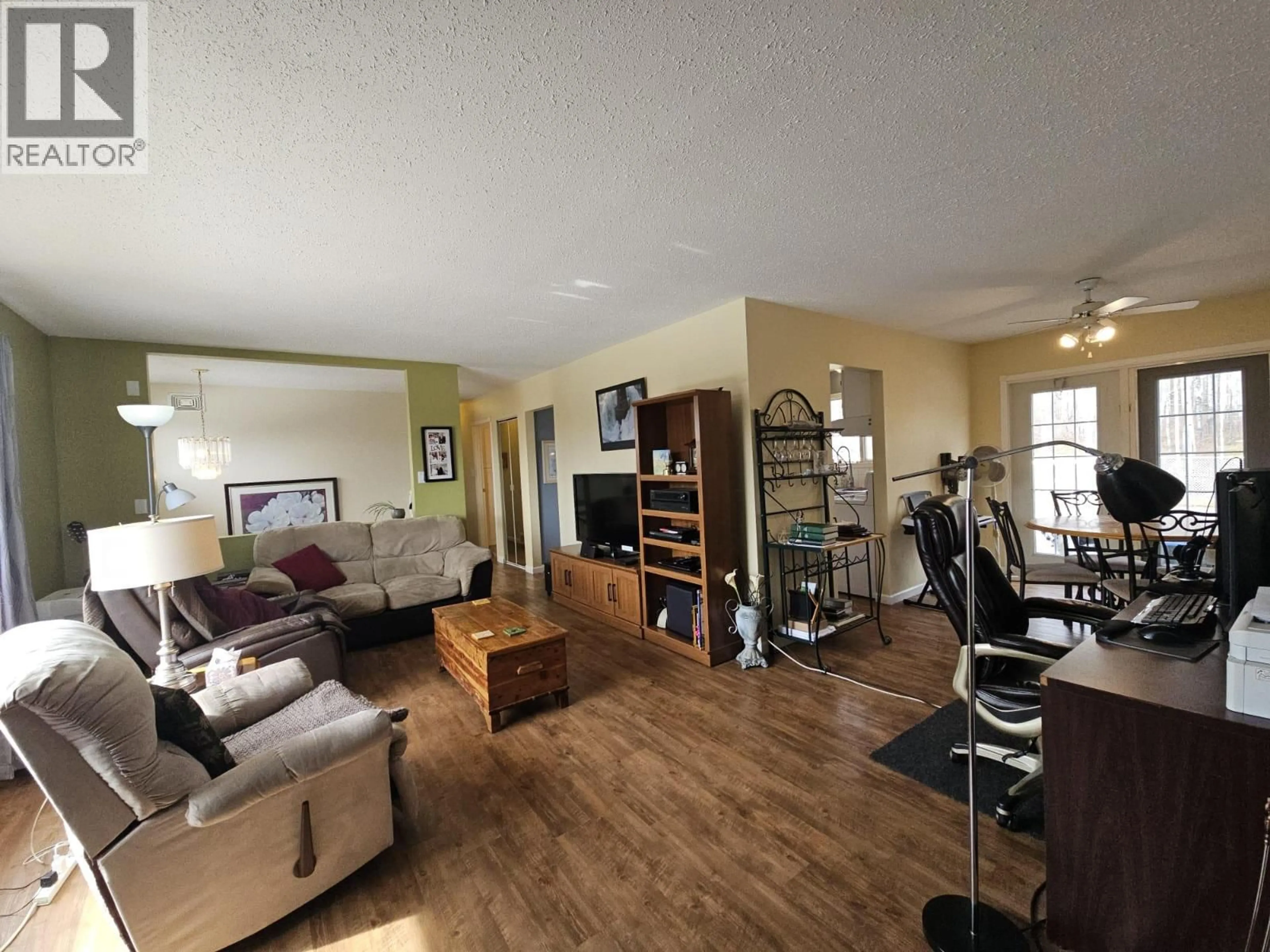 Living room with furniture, wood/laminate floor for 5334 KURJATA DRIVE, Chetwynd British Columbia V0C1J0