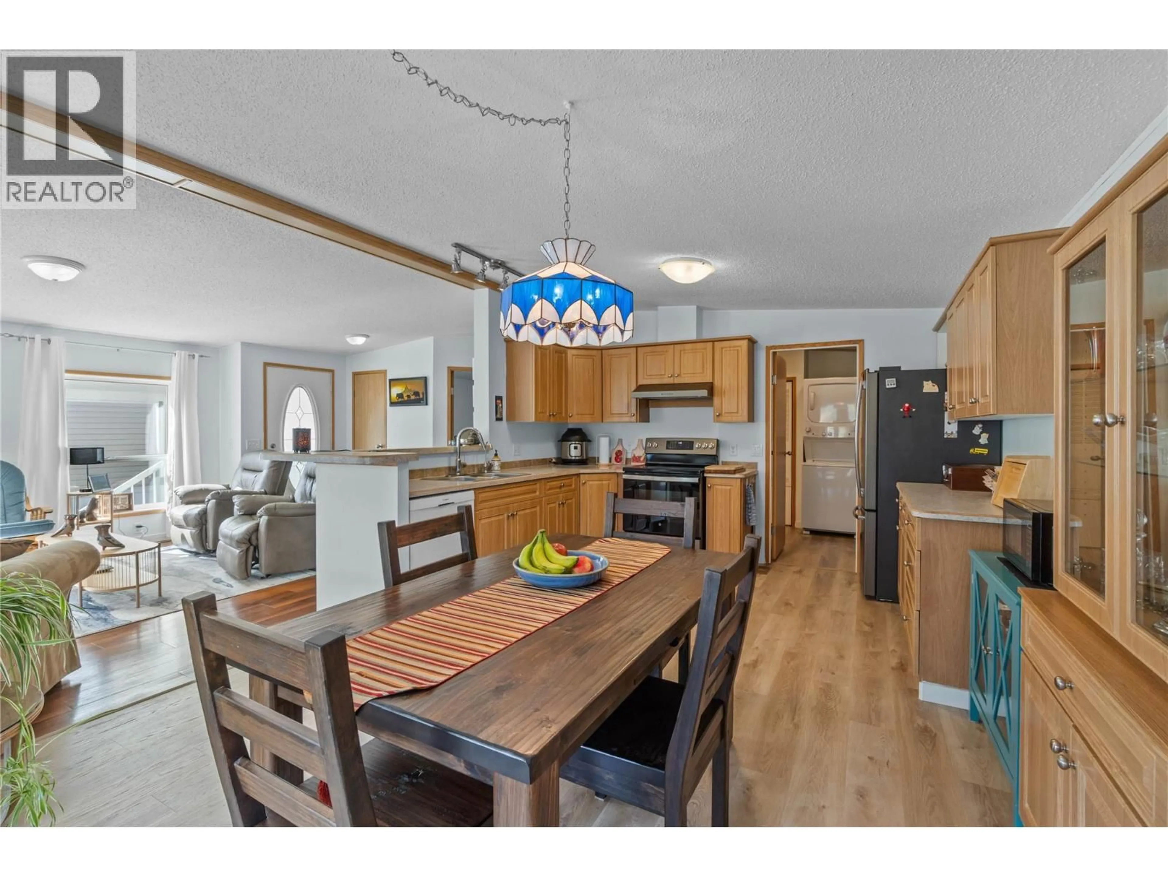 Open concept kitchen, wood/laminate floor for 2 - 1885 TAPPEN NOTCH HILL ROAD, Tappen British Columbia V0E2X3