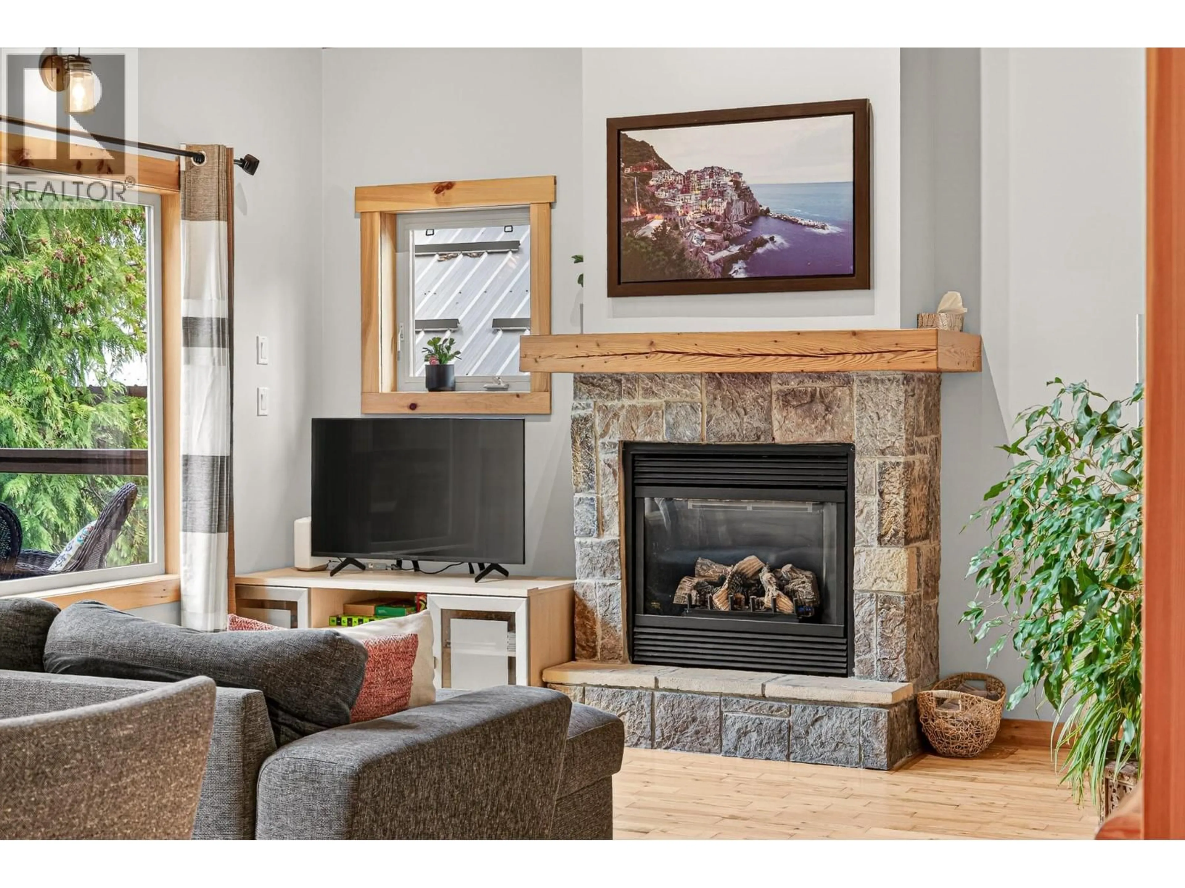 Living room with furniture, wood/laminate floor for 19 ALPINE TRAIL CRESCENT, Fernie British Columbia V0B1M5
