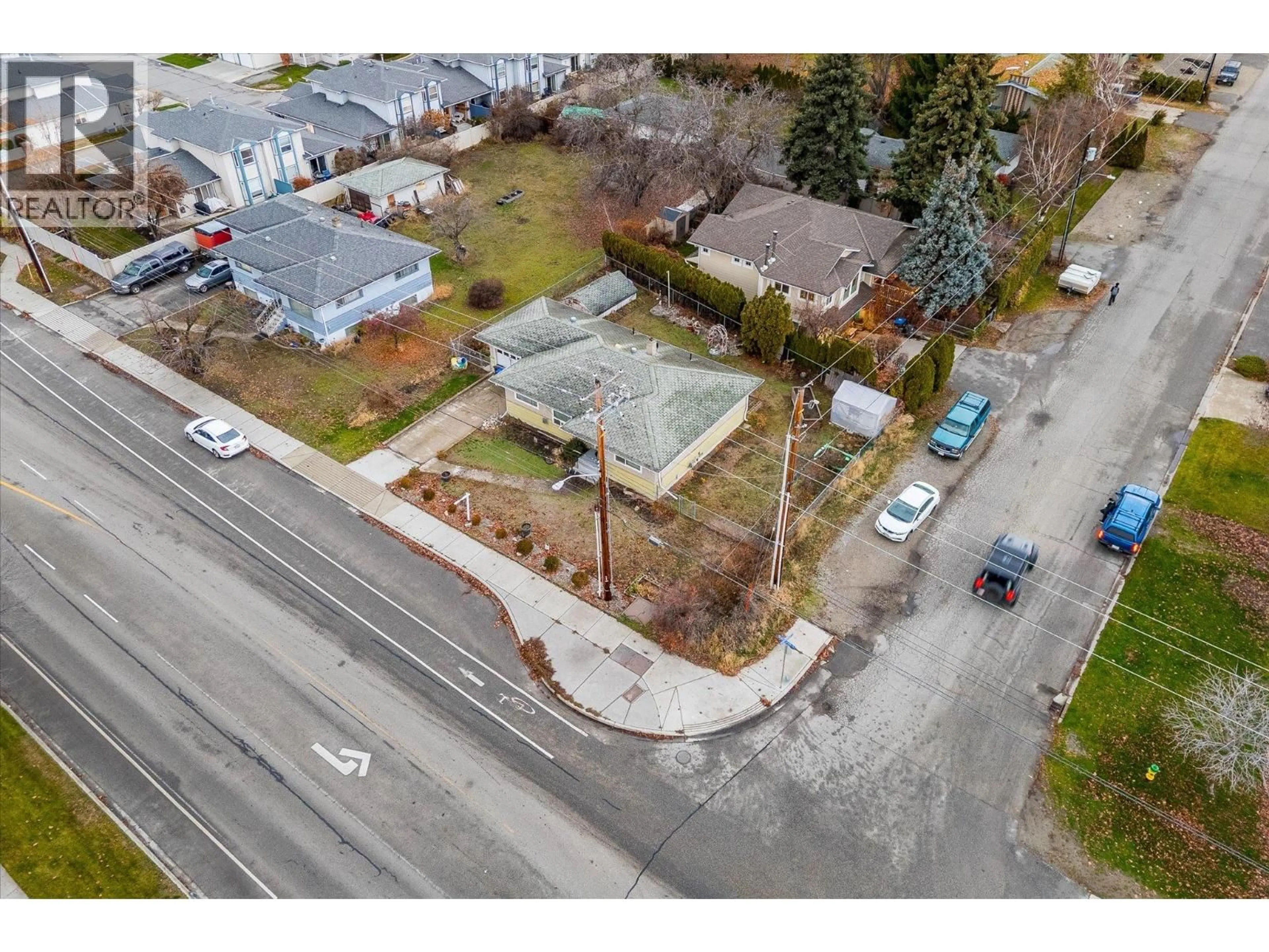 A pic from outside/outdoor area/front of a property/back of a property/a pic from drone, street for 1190 GUISACHAN ROAD, Kelowna British Columbia V1Y7X4