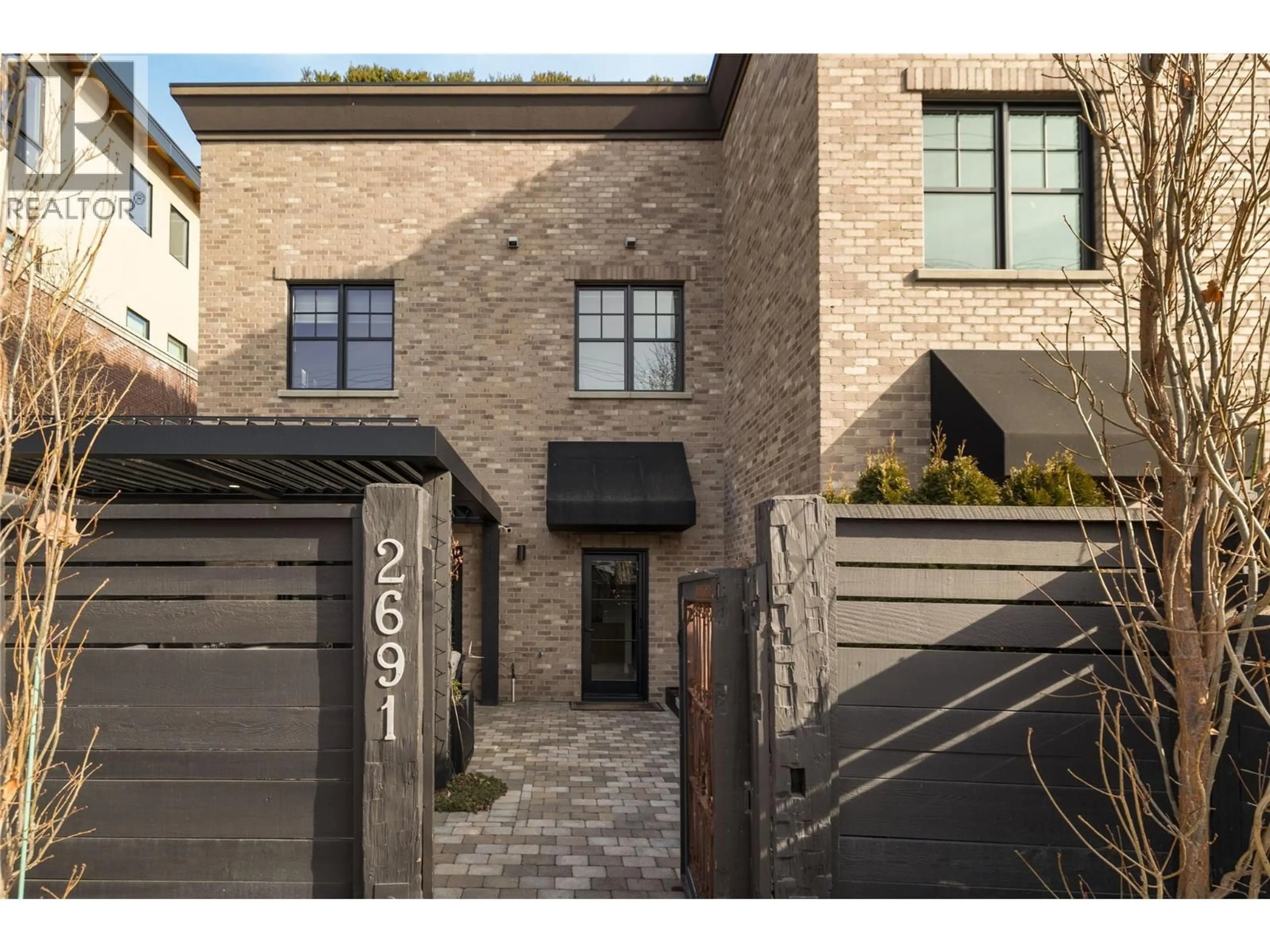 Home with brick exterior material, street for 2691 GORE STREET, Kelowna British Columbia V1Y5A5