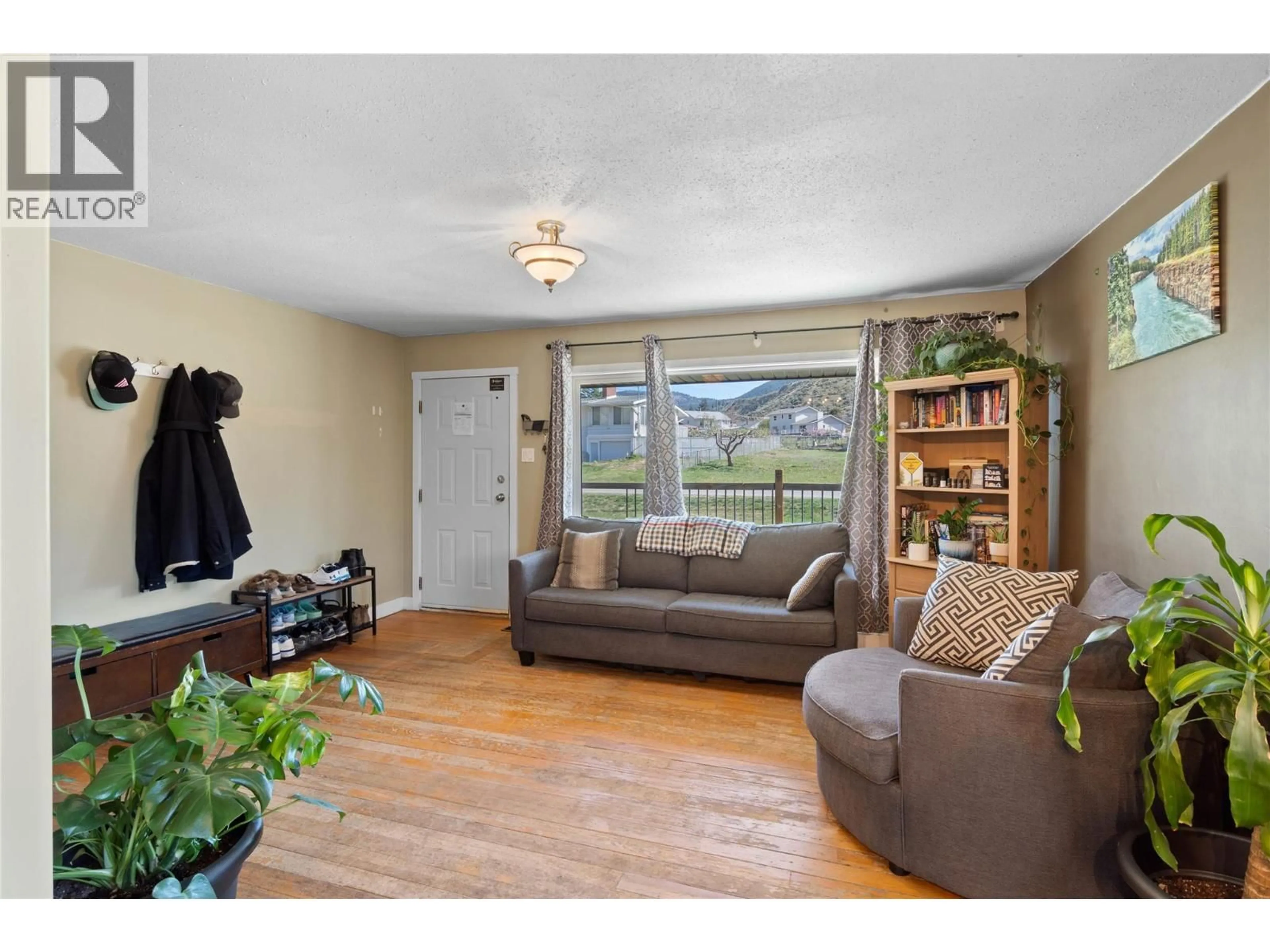 Living room with furniture, wood/laminate floor for 2164 CRESCENT DRIVE, Kamloops British Columbia V2C4J4