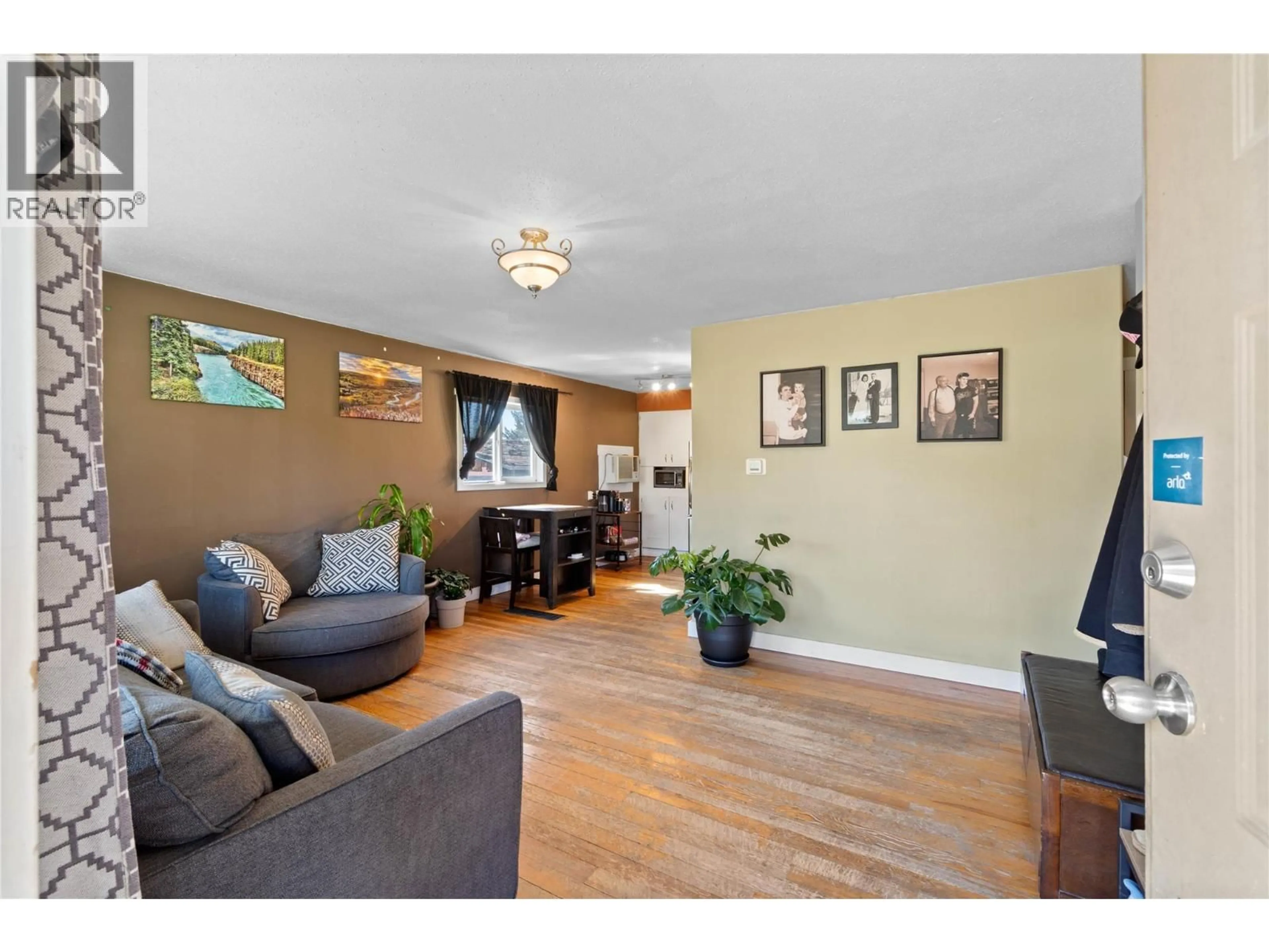 Living room with furniture, wood/laminate floor for 2164 CRESCENT DRIVE, Kamloops British Columbia V2C4J4