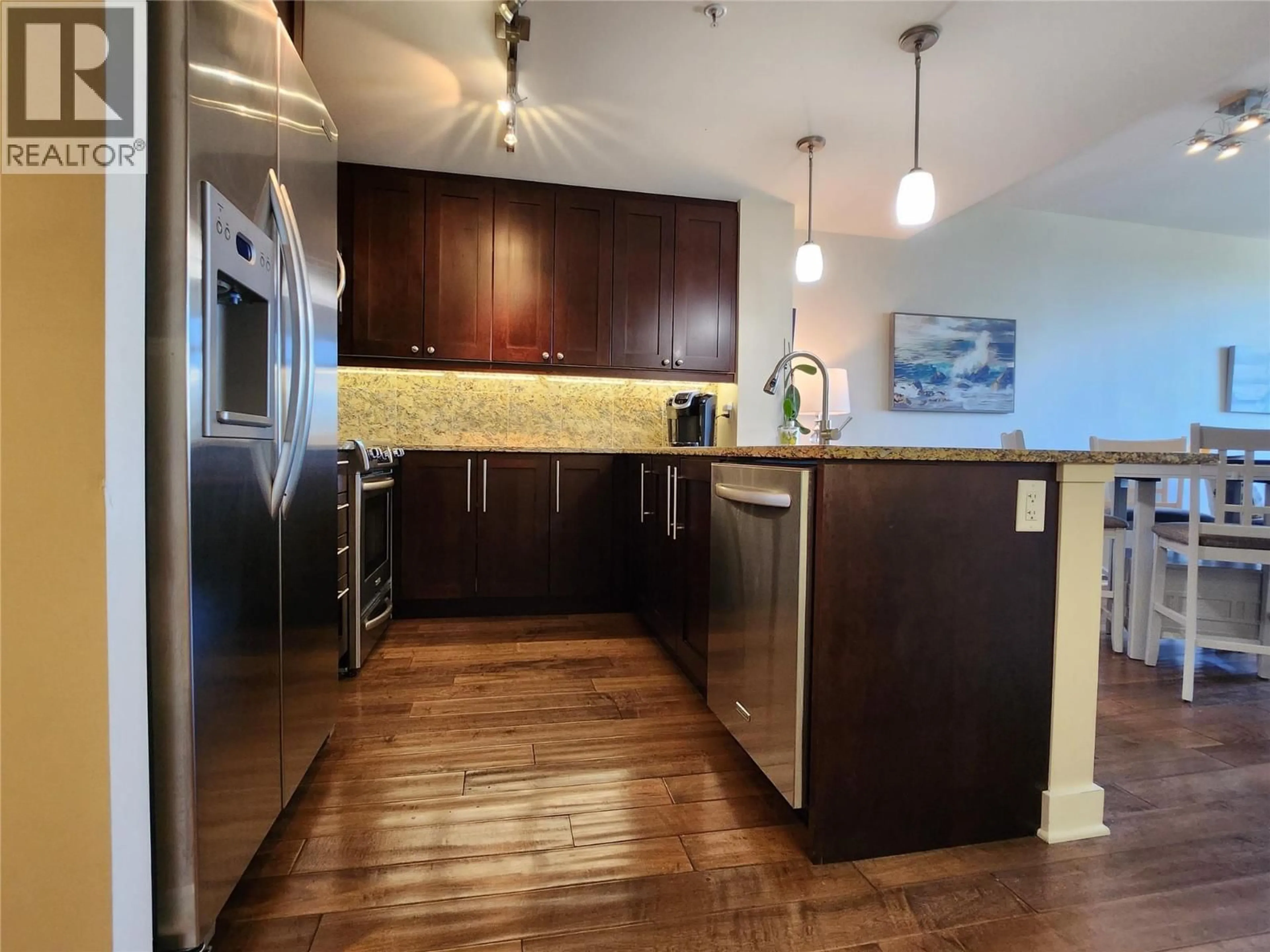 Open concept kitchen, wood/laminate floor for 1406 - 75 MARTIN STREET, Penticton British Columbia V2A9C8