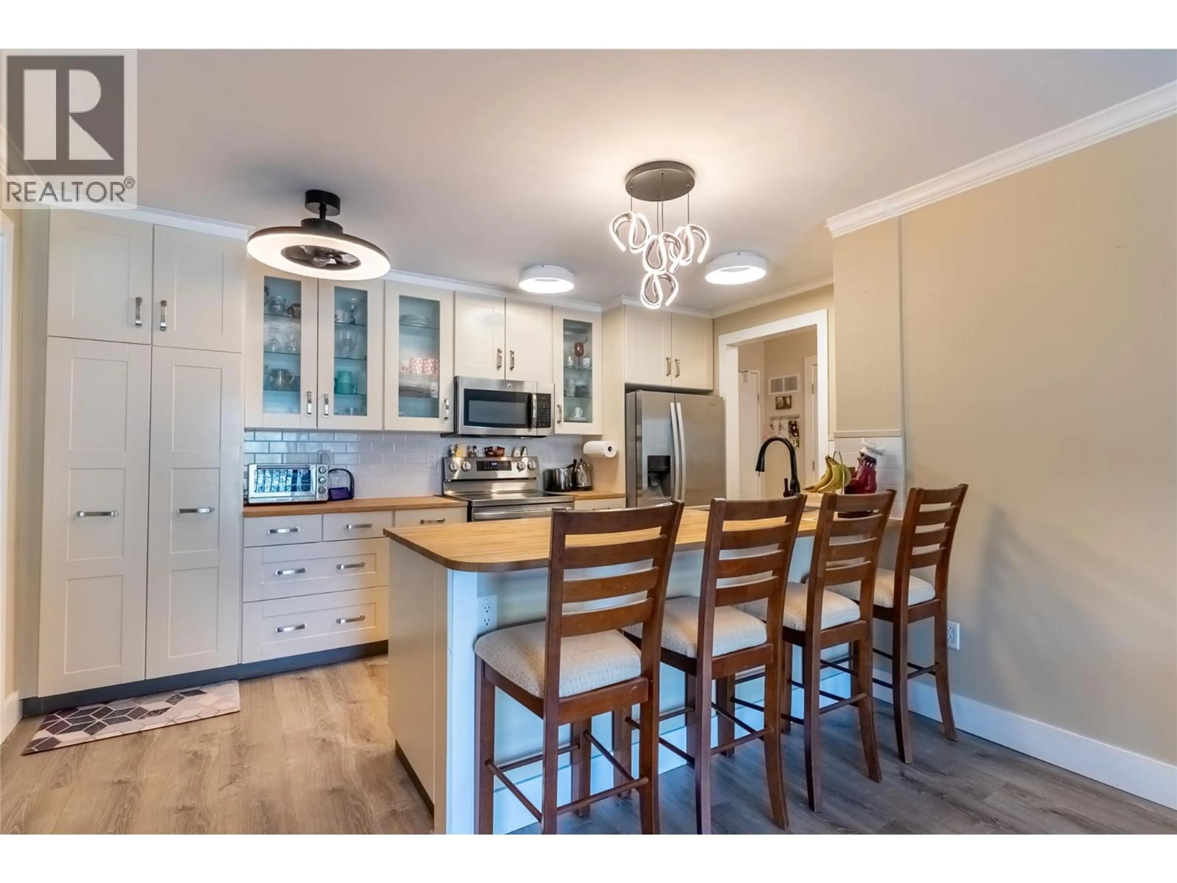 Open concept kitchen, wood/laminate floor for 308 - 308 CHARTRAND AVENUE, Logan Lake British Columbia V0K1W0