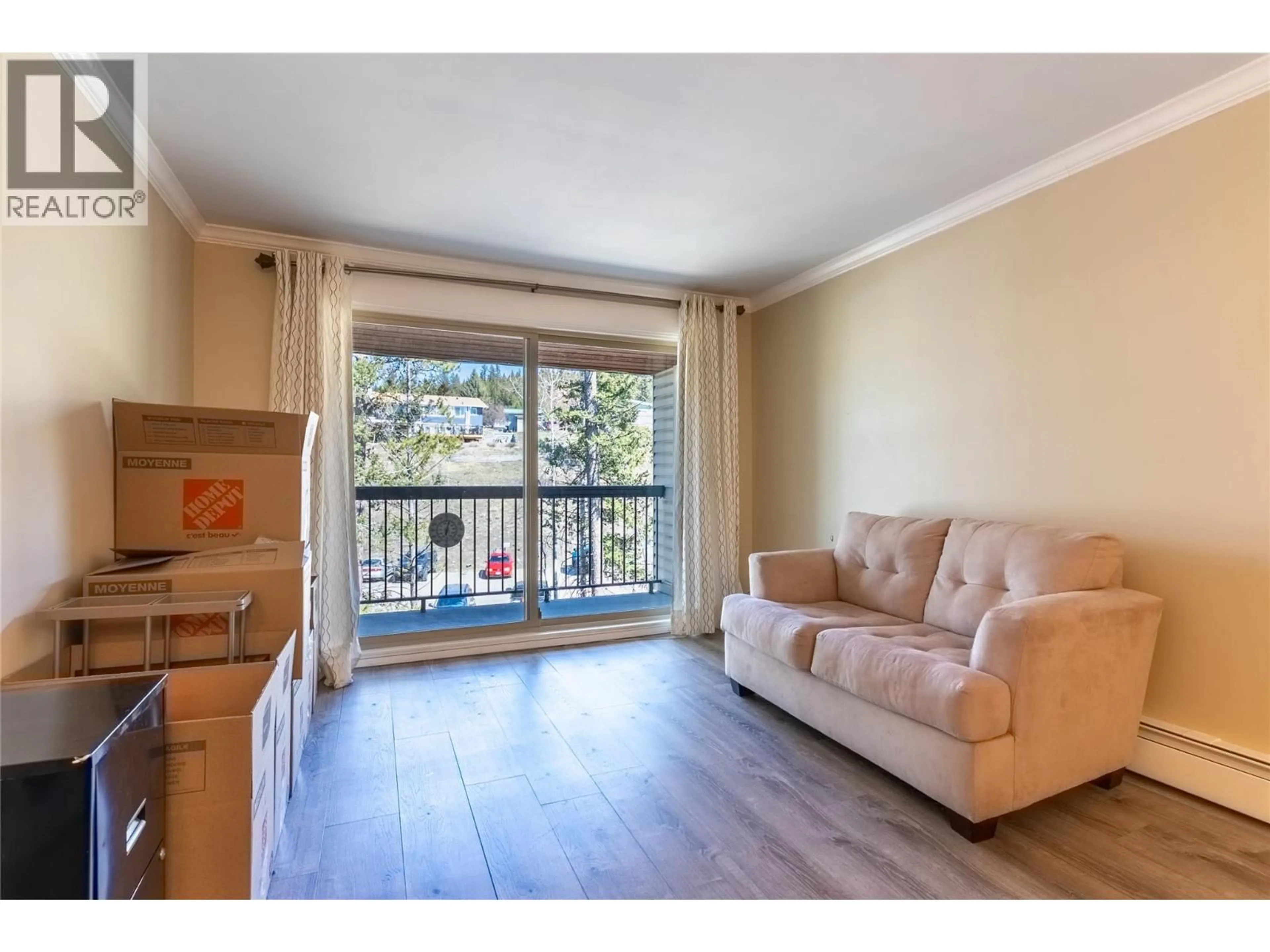 Living room with furniture, wood/laminate floor for 308 - 308 CHARTRAND AVENUE, Logan Lake British Columbia V0K1W0