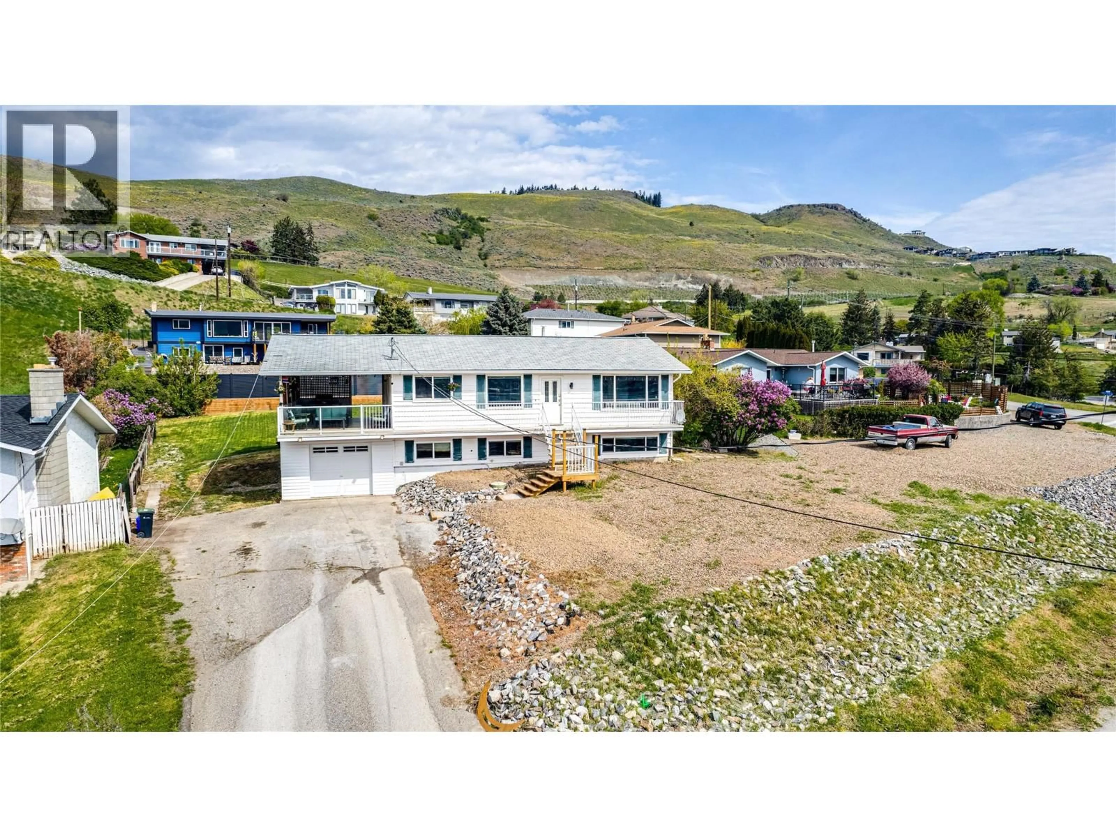 A pic from outside/outdoor area/front of a property/back of a property/a pic from drone, mountain view for 7415 TRONSON ROAD, Vernon British Columbia V1H1S4