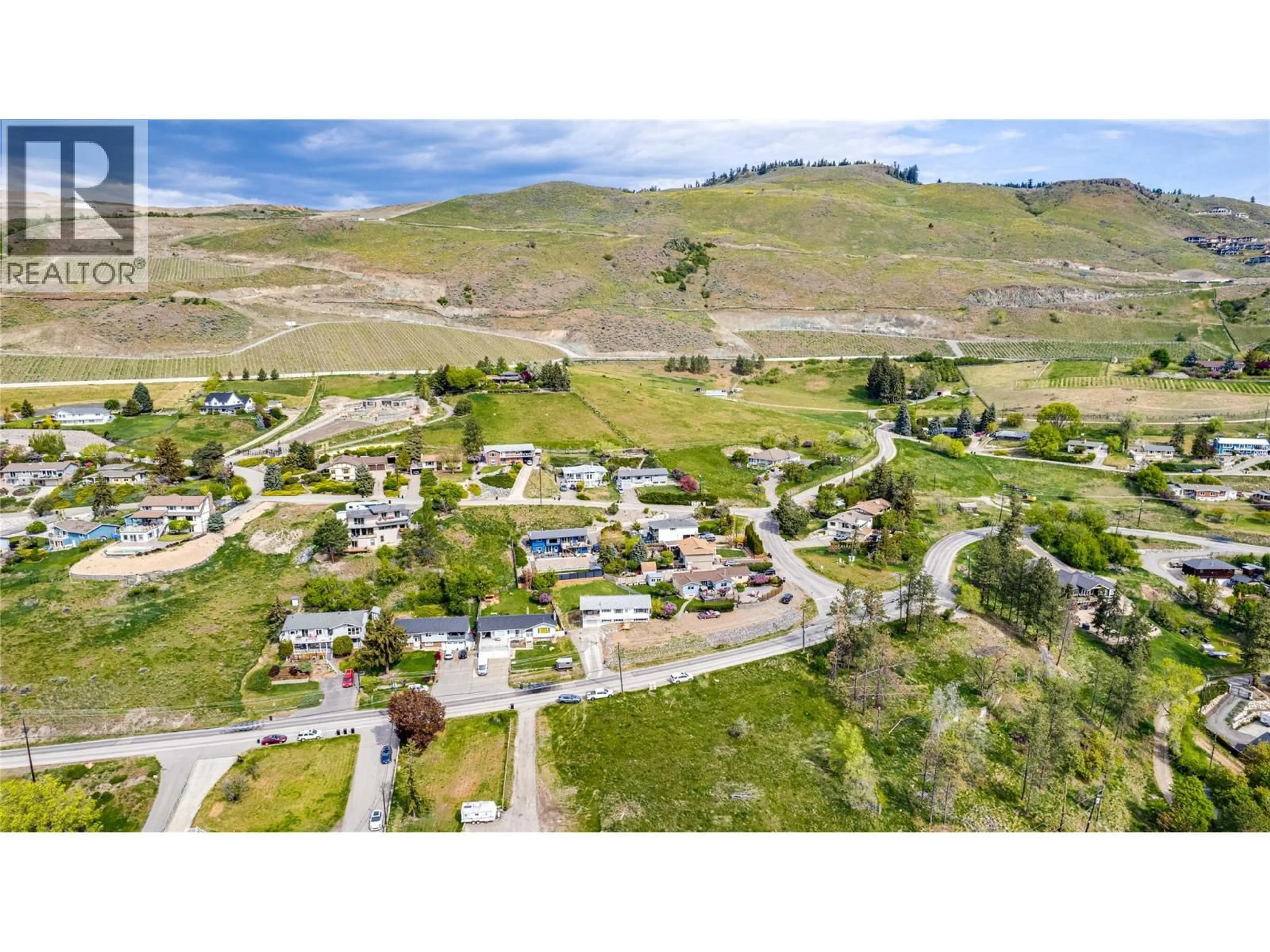 A pic from outside/outdoor area/front of a property/back of a property/a pic from drone, mountain view for 7415 TRONSON ROAD, Vernon British Columbia V1H1S4